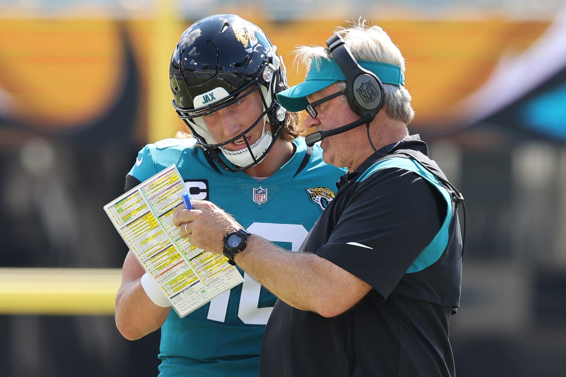 JACKSONVILLE, FLORIDA - OCTOBER 09: Head coach Doug Pederson of the Jacksonville Jaguars discusses a play with Trevor Lawrence #16 during the first half of the game against the Houston Texans at TIAA Bank Field on October 09, 2022 in Jacksonville, Florida. (Photo by Mike Carlson/Getty Images)