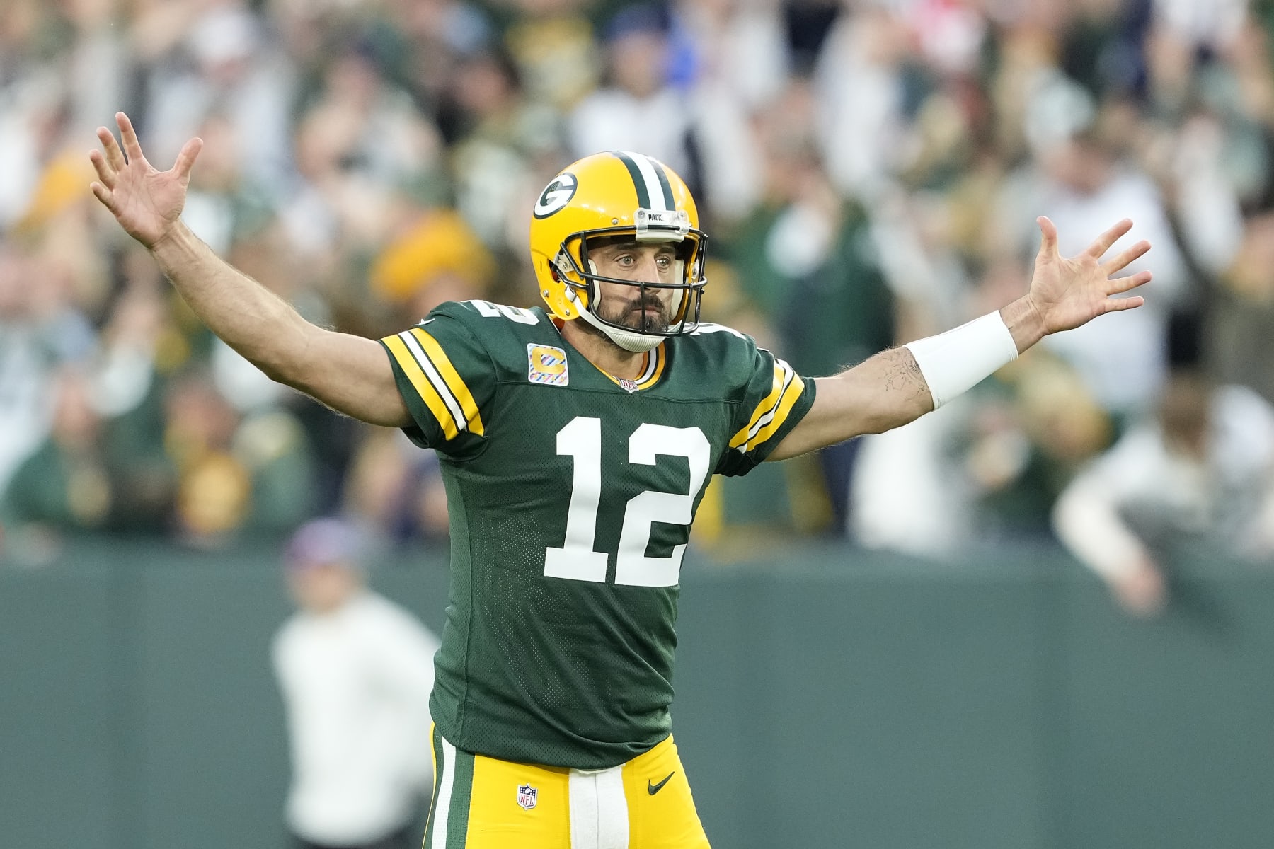 GREEN BAY, WISCONSIN - OCTOBER 02: Aaron Rodgers #12 of the Green Bay Packers reacts after a play in the second half against the New England Patriots at Lambeau Field on October 02, 2022 in Green Bay, Wisconsin. (Photo by Patrick McDermott/Getty Images)