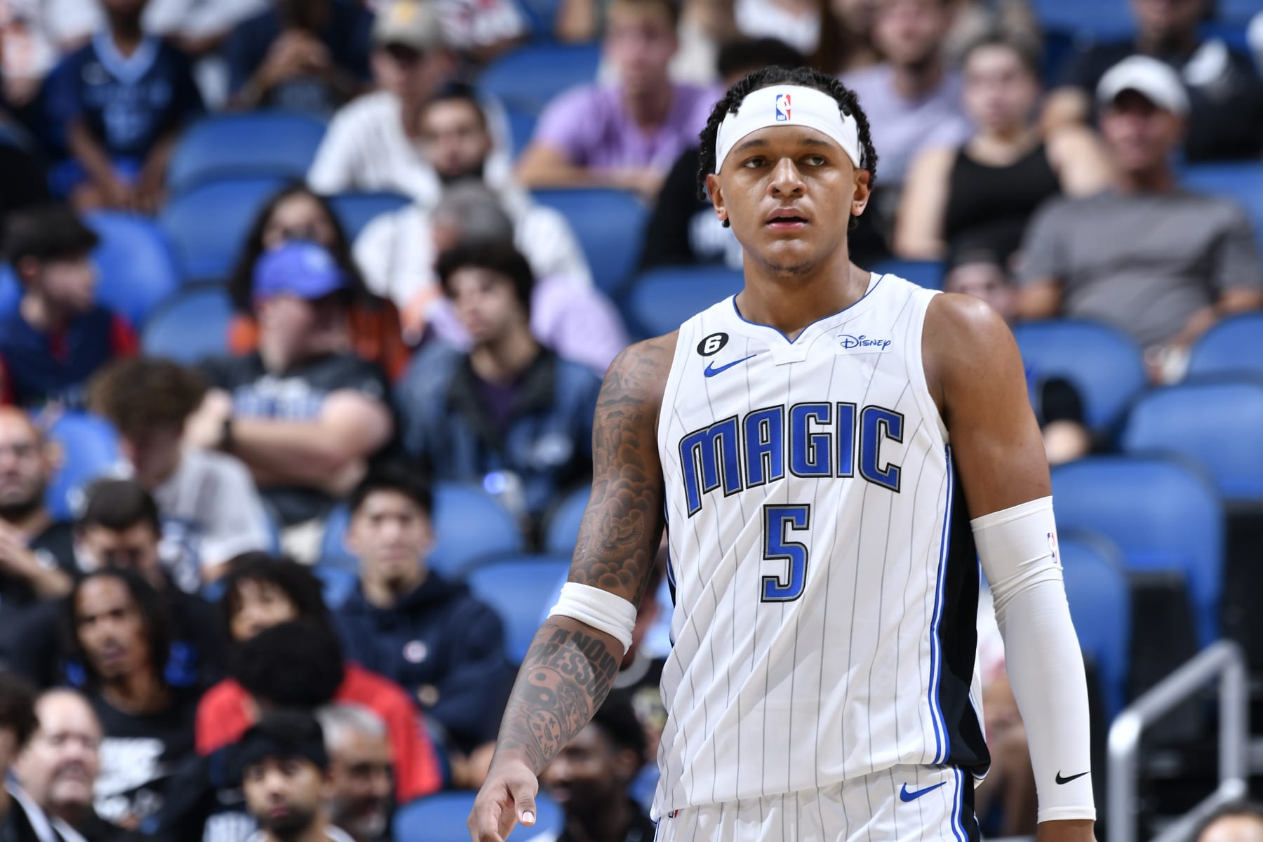 ORLANDO, FL - OCTOBER 11: Paolo Banchero #5 of the Orlando Magic looks on during the game against the Memphis Grizzlies on October 11, 2022 at Amway Center in Orlando, Florida. NOTE TO USER: User expressly acknowledges and agrees that, by downloading and or using this photograph, User is consenting to the terms and conditions of the Getty Images License Agreement. Mandatory Copyright Notice: Copyright 2022 NBAE (Photo by Fernando Medina/NBAE via Getty Images)