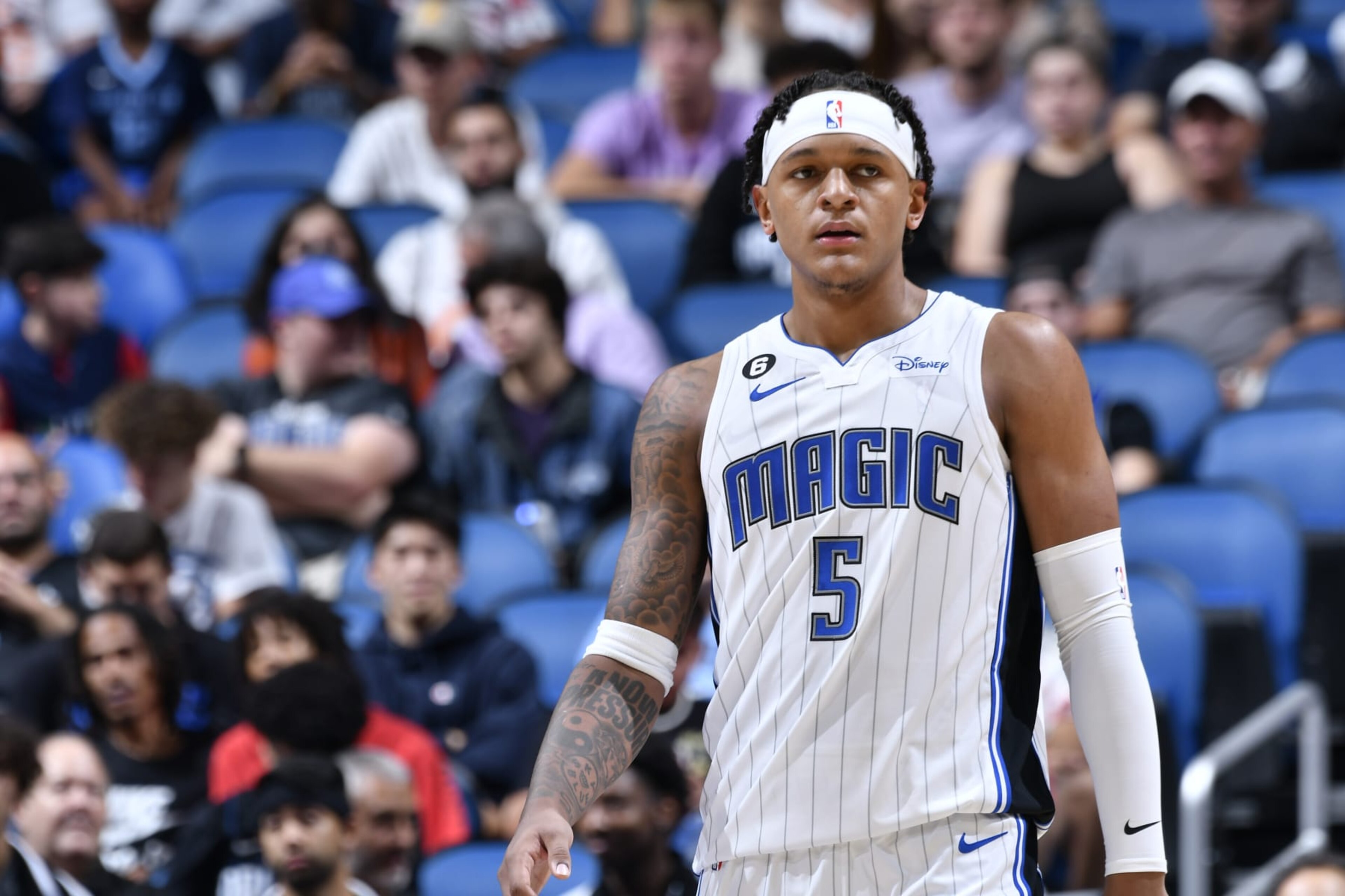 ORLANDO, FL - OCTOBER 11: Paolo Banchero #5 of the Orlando Magic looks on during the game against the Memphis Grizzlies on October 11, 2022 at Amway Center in Orlando, Florida. NOTE TO USER: User expressly acknowledges and agrees that, by downloading and or using this photograph, User is consenting to the terms and conditions of the Getty Images License Agreement. Mandatory Copyright Notice: Copyright 2022 NBAE (Photo by Fernando Medina/NBAE via Getty Images)