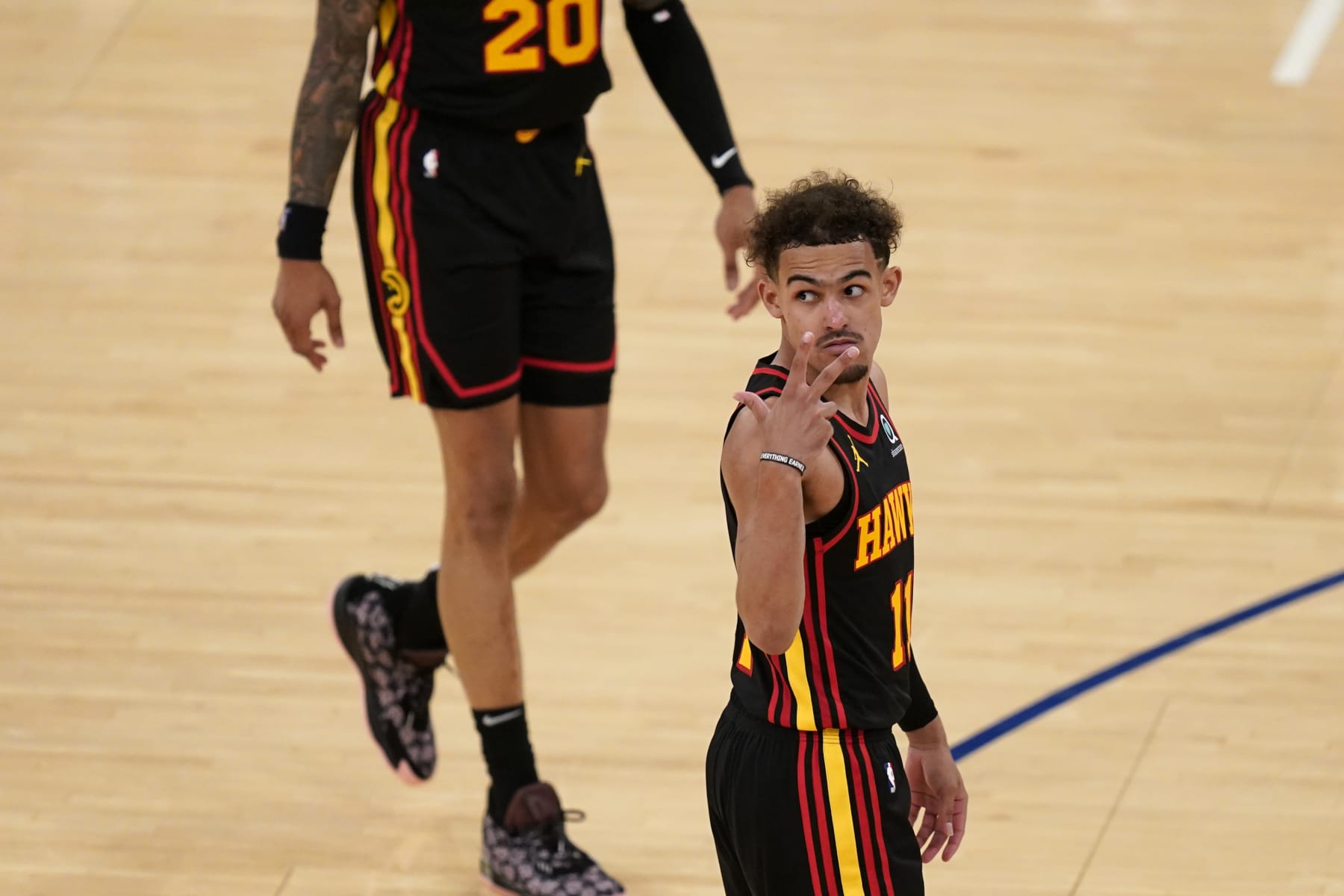 NEW YORK, NY - MAY 23: Atlanta Hawks' Trae Young gestures during the second half of Game 1 of an NBA basketball first-round playoff series against the New York Knicks on May 23, 2021 in New York City. NOTE TO USER: User expressly acknowledges and agrees that,  by downloading and or using this photograph,  User is consenting to the terms and conditions of the Getty Images License Agreement. (Photo by Seth Wenig - Pool/Getty Images)