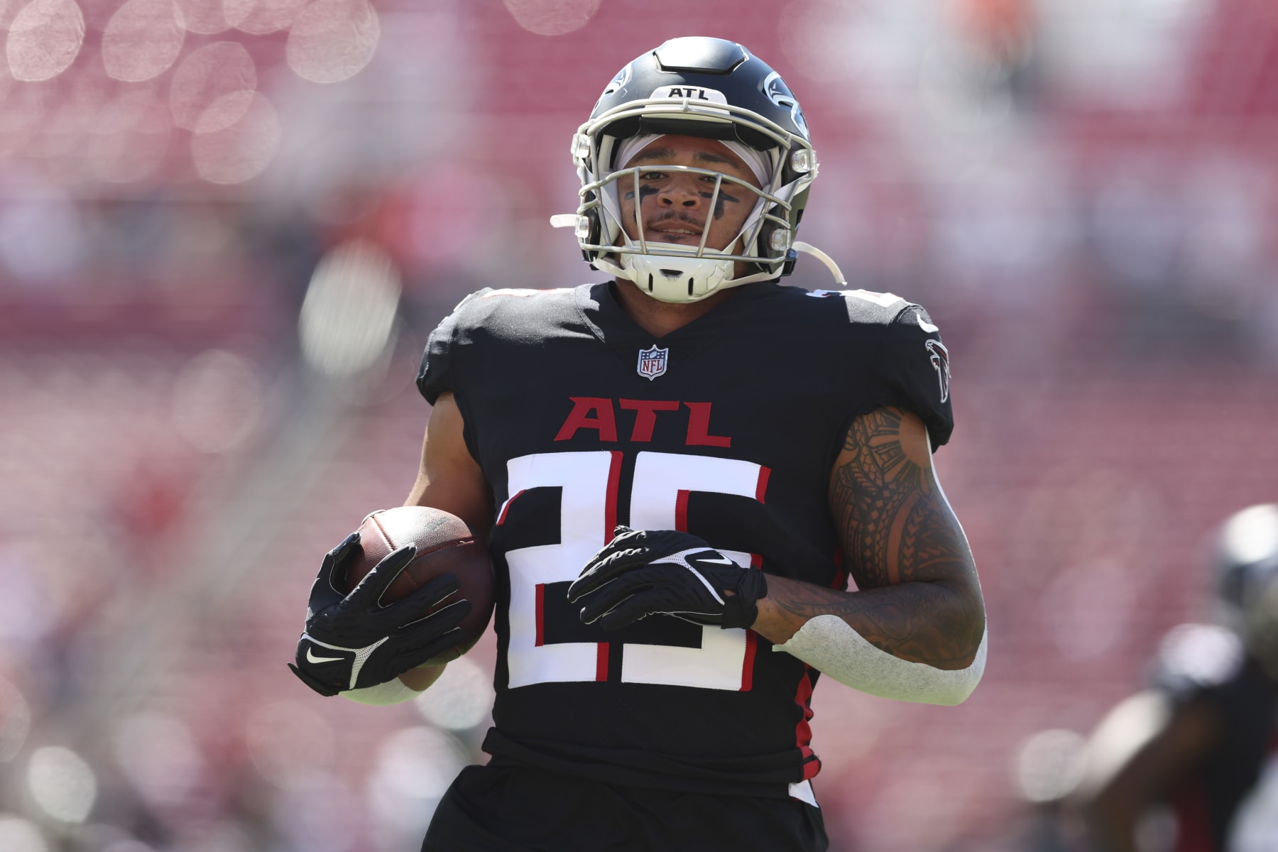 Atlanta Falcons running back Tyler Allgeier (25) warms up before the first half of an NFL football game between the Tampa Bay Buccaneers and the Atlanta Falcons, Sunday, Oct. 9, 2022, in Tampa, Fla. (AP Photo/Mark LoMoglio)