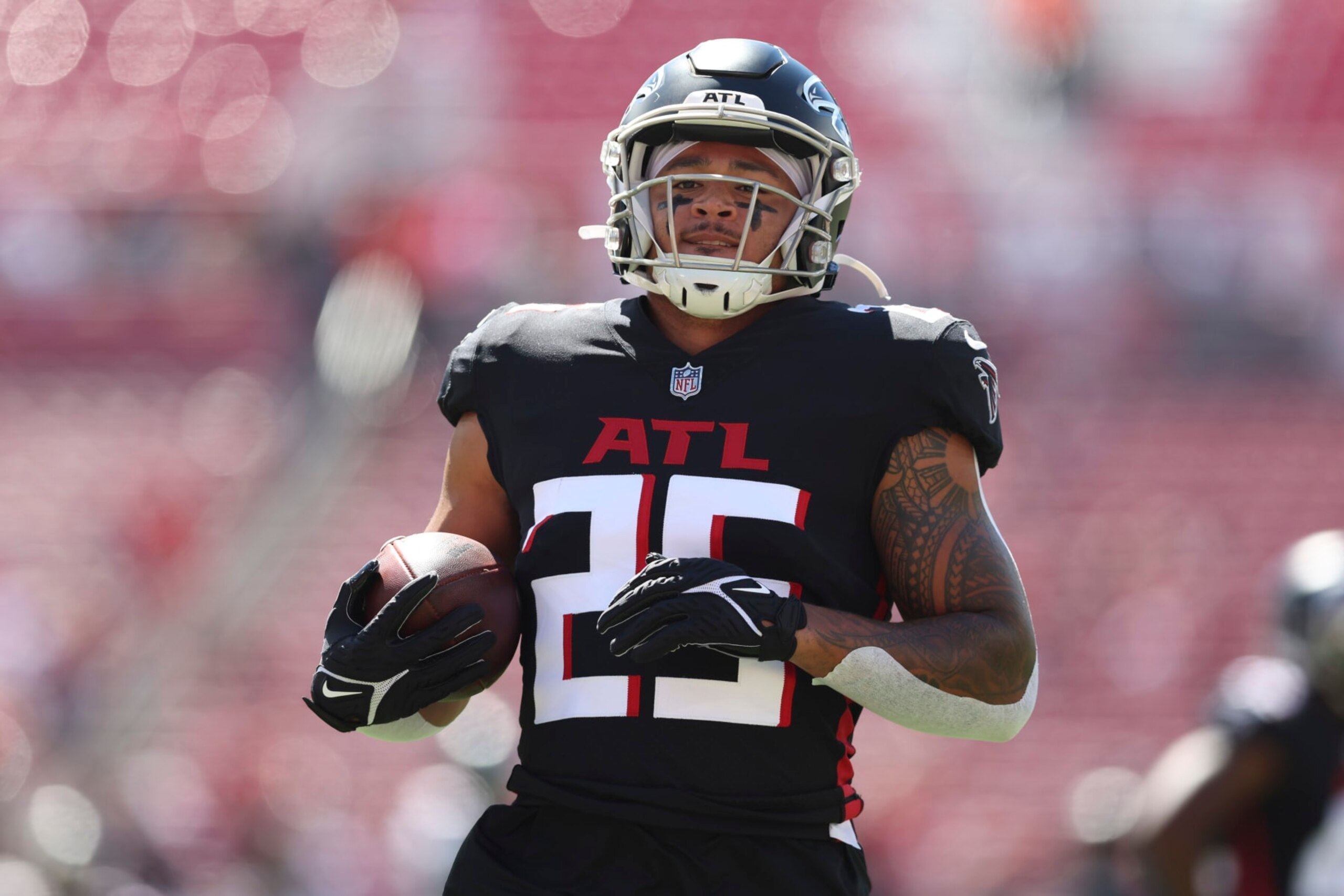 Atlanta Falcons running back Tyler Allgeier (25) warms up before the first half of an NFL football game between the Tampa Bay Buccaneers and the Atlanta Falcons, Sunday, Oct. 9, 2022, in Tampa, Fla. (AP Photo/Mark LoMoglio)
