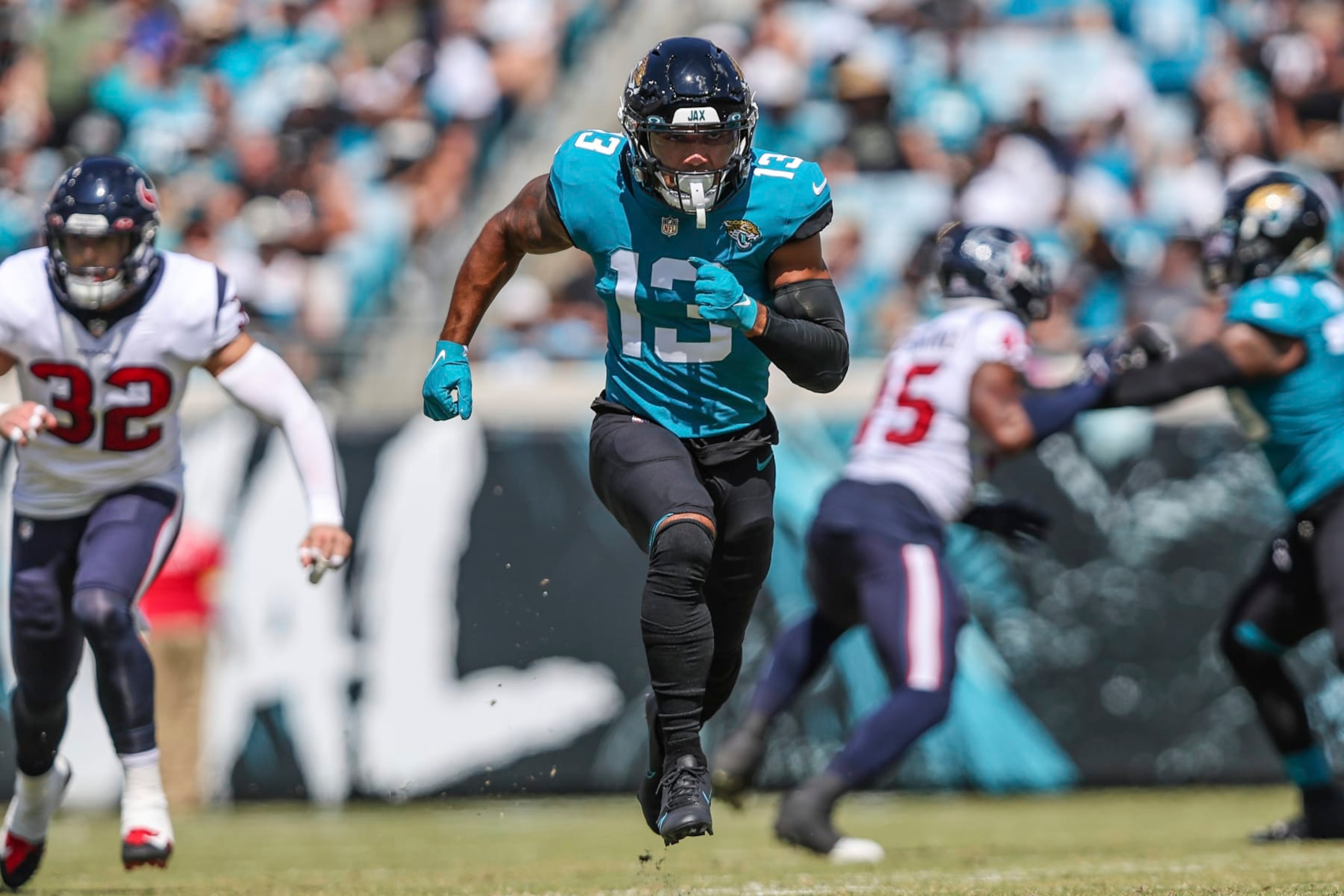 Jacksonville Jaguars wide receiver Christian Kirk (13) runs a route during an NFL football game against the Houston Texans on Sunday, Oct. 9, 2022, in Jacksonville, Fla. (AP Photo/Gary McCullough)