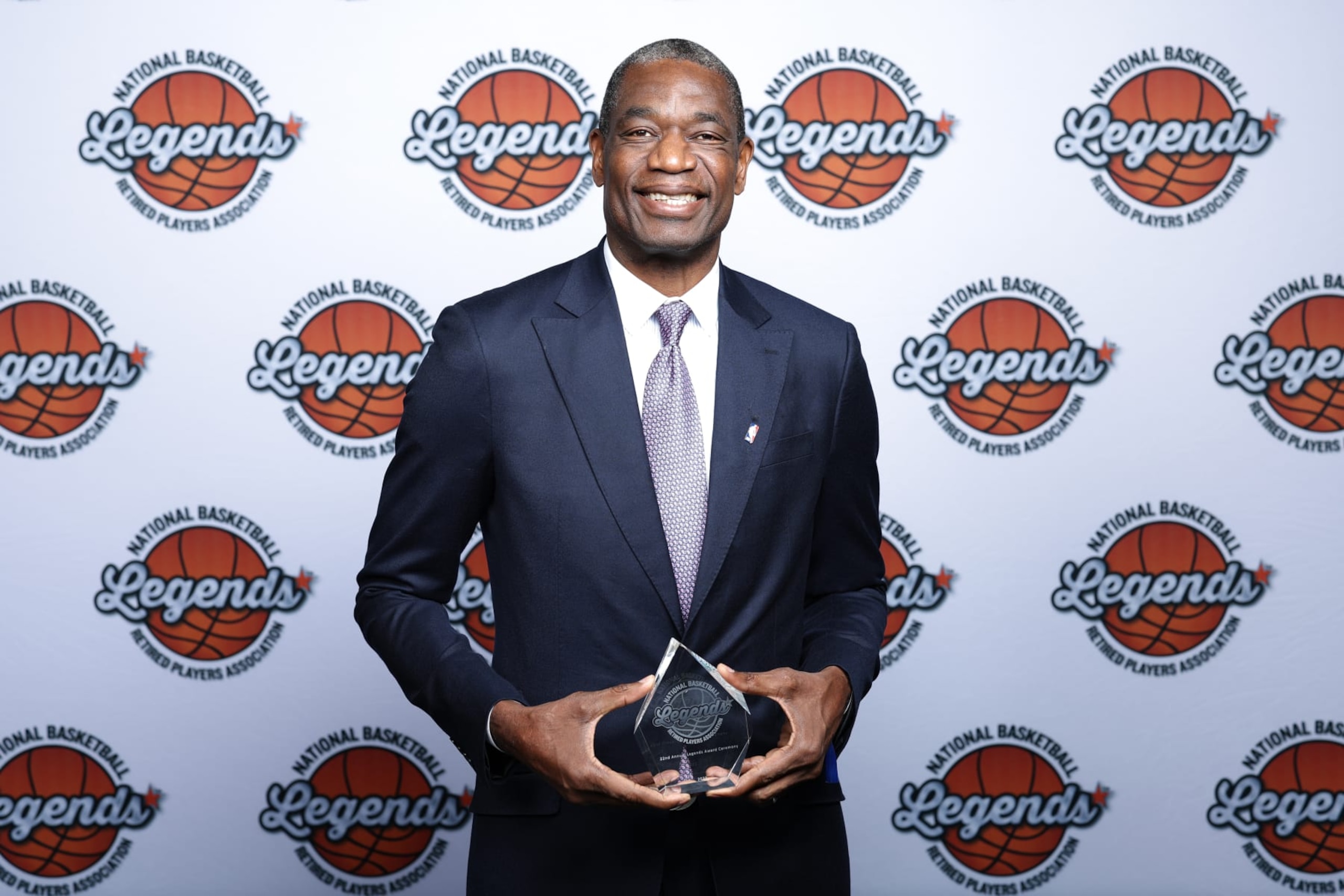 CLEVELAND, OH - FEBRUARY 20: NBA Legend, Dikembe Mutombo poses for a portrait with the Global Ambassador Award during the 22nd Annual NBA Legends Awards as part of 2022 NBA All Star Weekend on February 20, 2022 at Huntington Convention Center in Cleveland, Ohio. NOTE TO USER: User expressly acknowledges and agrees that, by downloading and/or using this Photograph, user is consenting to the terms and conditions of the Getty Images License Agreement. Mandatory Copyright Notice: Copyright 2022 NBAE (Photo by David Sherman/NBAE via Getty Images)