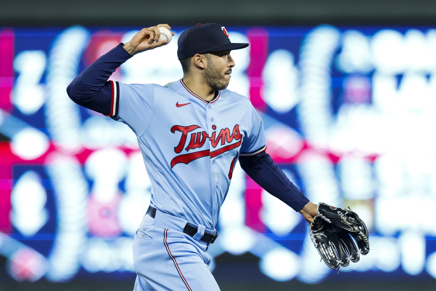 MINNEAPOLIS, MN - SEPTEMBER 27: Carlos Correa #4 of the Minnesota Twins throws the ball to first base to get out Elvis Andrus #1 of the Chicago White Sox in the sixth inning of the game at Target Field on September 27, 2022 in Minneapolis, Minnesota. The Twins defeated the White Sox 4-0. (Photo by David Berding/Getty Images)