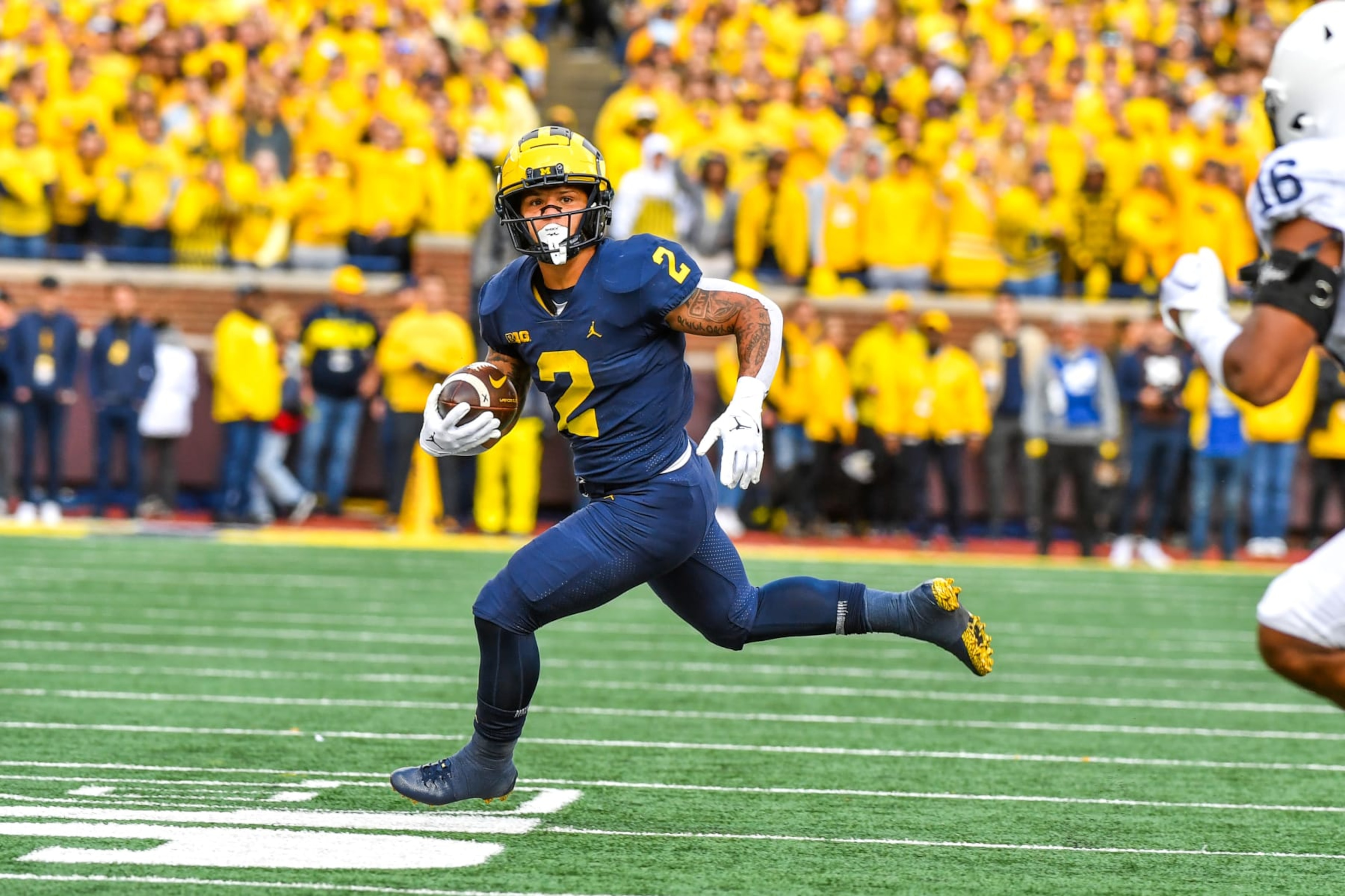 ANN ARBOR, MICHIGAN - OCTOBER 15: Blake Corum #2 of the Michigan Wolverines runs with the ball during the first half of a college football game against the Penn State Nittany Lions at Michigan Stadium on October 15, 2022 in Ann Arbor, Michigan. (Photo by Aaron J. Thornton/Getty Images)