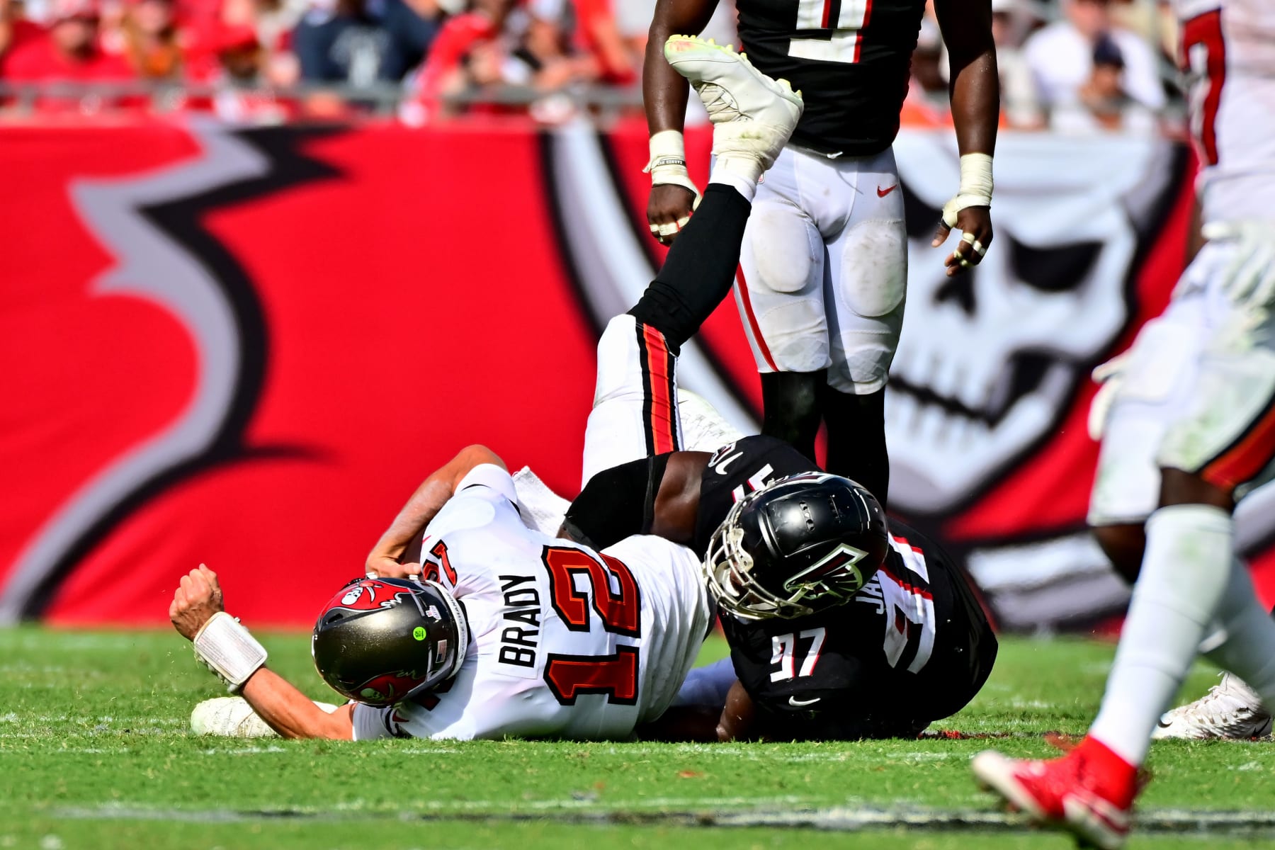 TAMPA, FLORIDA - OCTOBER 09: Grady Jarrett #97 of the Atlanta Falcons sacks Tom Brady #12 of the Tampa Bay Buccaneers during the fourth quarter of the game at Raymond James Stadium on October 09, 2022 in Tampa, Florida. (Photo by Julio Aguilar/Getty Images)
