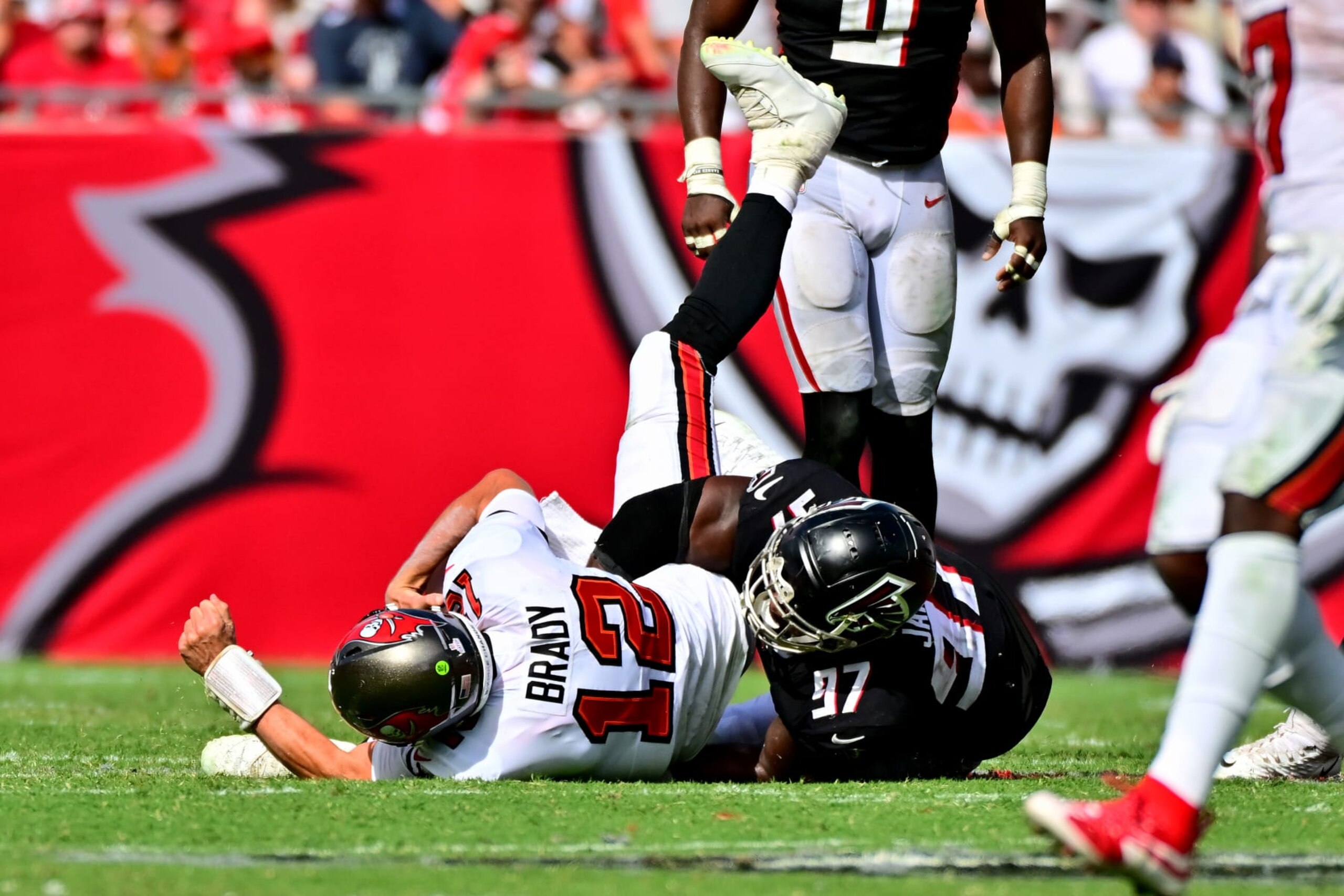 TAMPA, FLORIDA - OCTOBER 09: Grady Jarrett #97 of the Atlanta Falcons sacks Tom Brady #12 of the Tampa Bay Buccaneers during the fourth quarter of the game at Raymond James Stadium on October 09, 2022 in Tampa, Florida. (Photo by Julio Aguilar/Getty Images)
