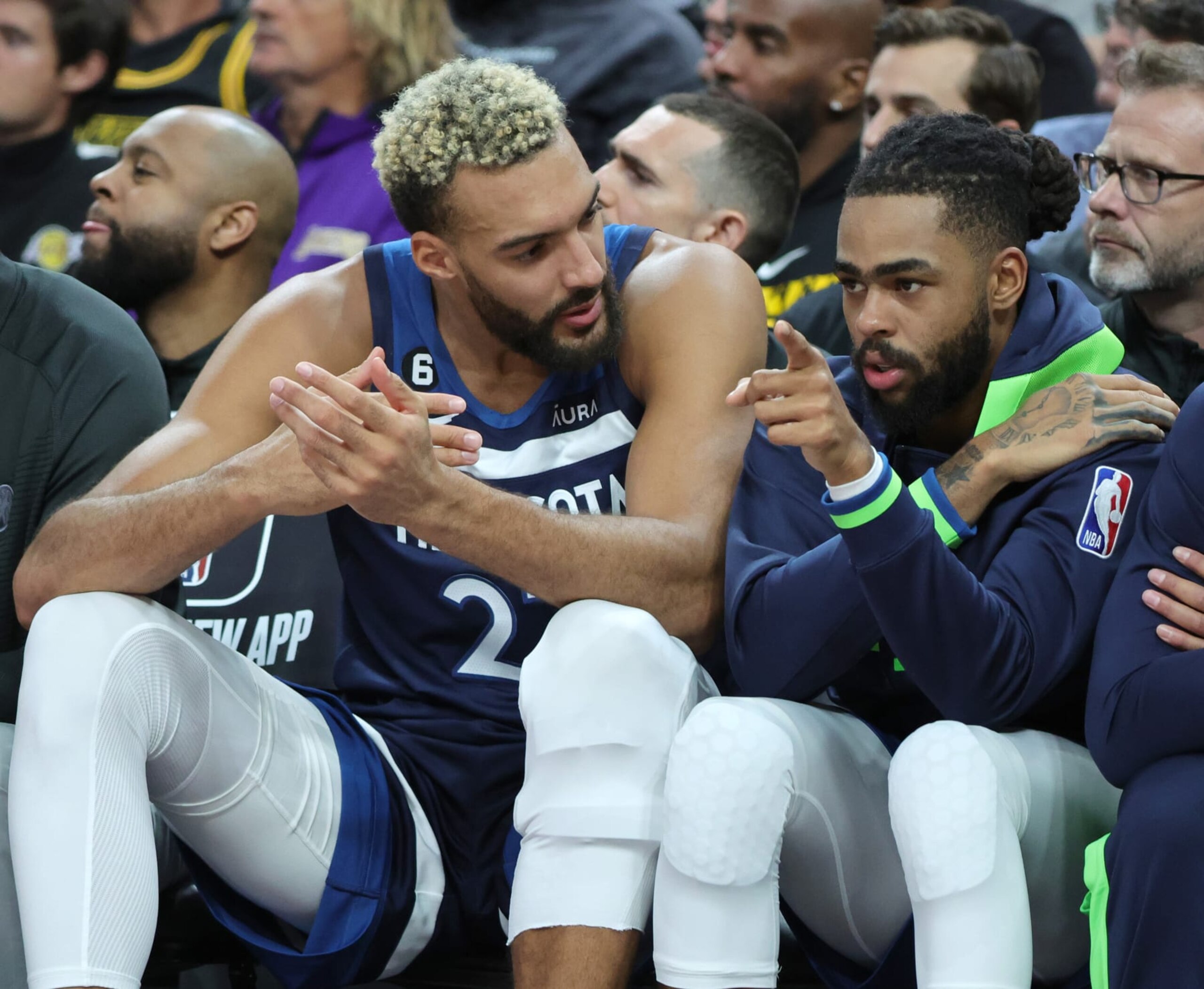 LAS VEGAS, NEVADA - OCTOBER 06: Rudy Gobert #27 and D'Angelo Russell #0 of the Minnesota Timberwolves talk on the bench in the first quarter of their preseason game against the Los Angeles Lakers at T-Mobile Arena on October 06, 2022 in Las Vegas, Nevada. The Timberwolves defeated the Lakers 114-99. NOTE TO USER: User expressly acknowledges and agrees that, by downloading and or using this photograph, User is consenting to the terms and conditions of the Getty Images License Agreement. (Photo by Ethan Miller/Getty Images)