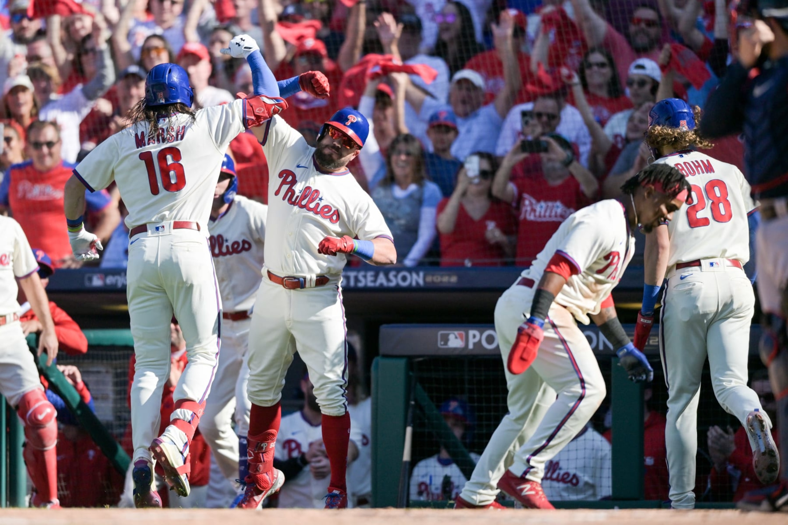 PHILADELPHIA, PA - OCTOBER 15:   Brandon Marsh #16 of the Philadelphia Phillies celebrates with Kyle Schwarber #12 after hitting a three-run home run in the second inning during the game between the Atlanta Braves and the Philadelphia Phillies at Citizens Bank Park on Saturday, October 15, 2022 in Philadelphia, Pennsylvania. (Photo by Drew Hallowell/MLB Photos via Getty Images)