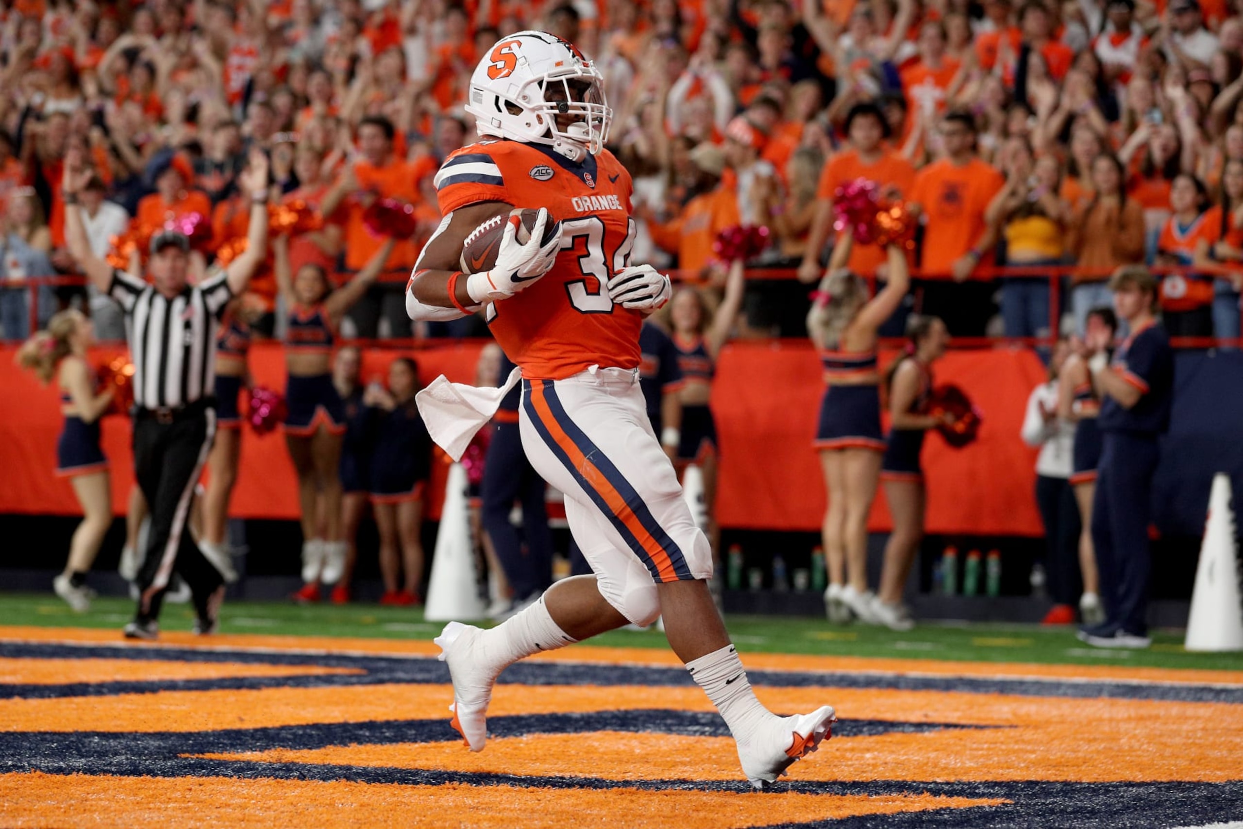 SYRACUSE, NEW YORK - OCTOBER 01: Sean Tucker #34 of the Syracuse Orange scores a touchdown during the first quarter against the Wagner Seahawks at JMA Wireless Dome on October 01, 2022 in Syracuse, New York. (Photo by Bryan Bennett/Getty Images) SYRACUSE, NEW YORK - OCTOBER 01: Sean Tucker #34 of the Syracuse Orange scores a touchdown during the first quarter against the Wagner Seahawks at JMA Wireless Dome on October 01, 2022 in Syracuse, New York. (Photo by Bryan Bennett/Getty Images)