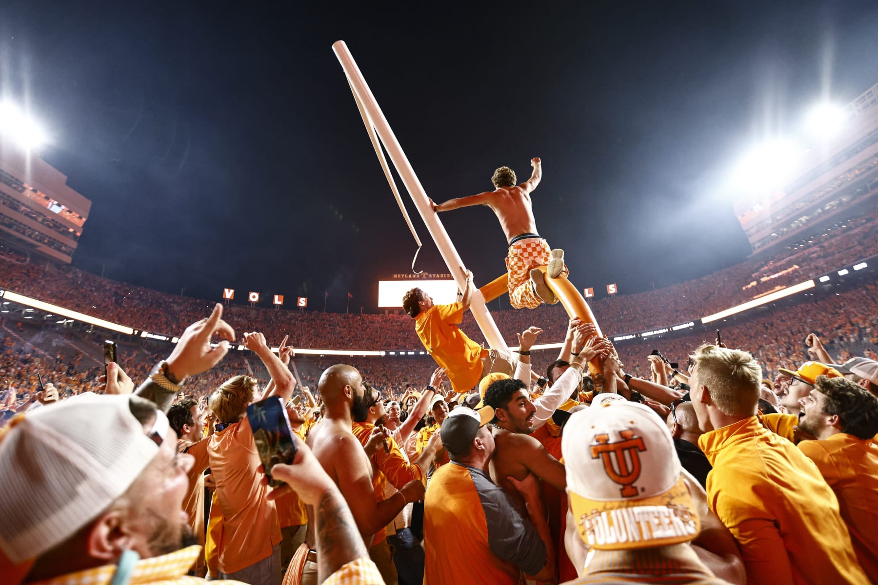 Tennessee fans tear down the goal post after defeating Alabama 52-49 in an NCAA college football game Saturday, Oct. 15, 2022, in Knoxville, Tenn. (AP Photo/Wade Payne)