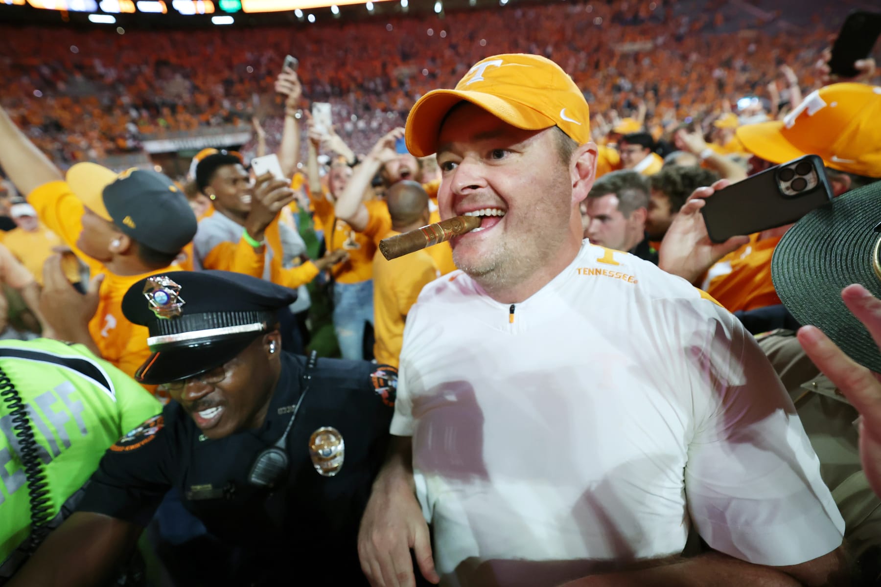KNOXVILLE, TENNESSEE - OCTOBER 15: Head coach Josh Heupel of the Tennessee Volunteers celebrates a win over the Alabama Crimson Tide with a cigar at Neyland Stadium on October 15, 2022 in Knoxville, Tennessee. Tennessee won the game 52-49. (Photo by Donald Page/Getty Images)