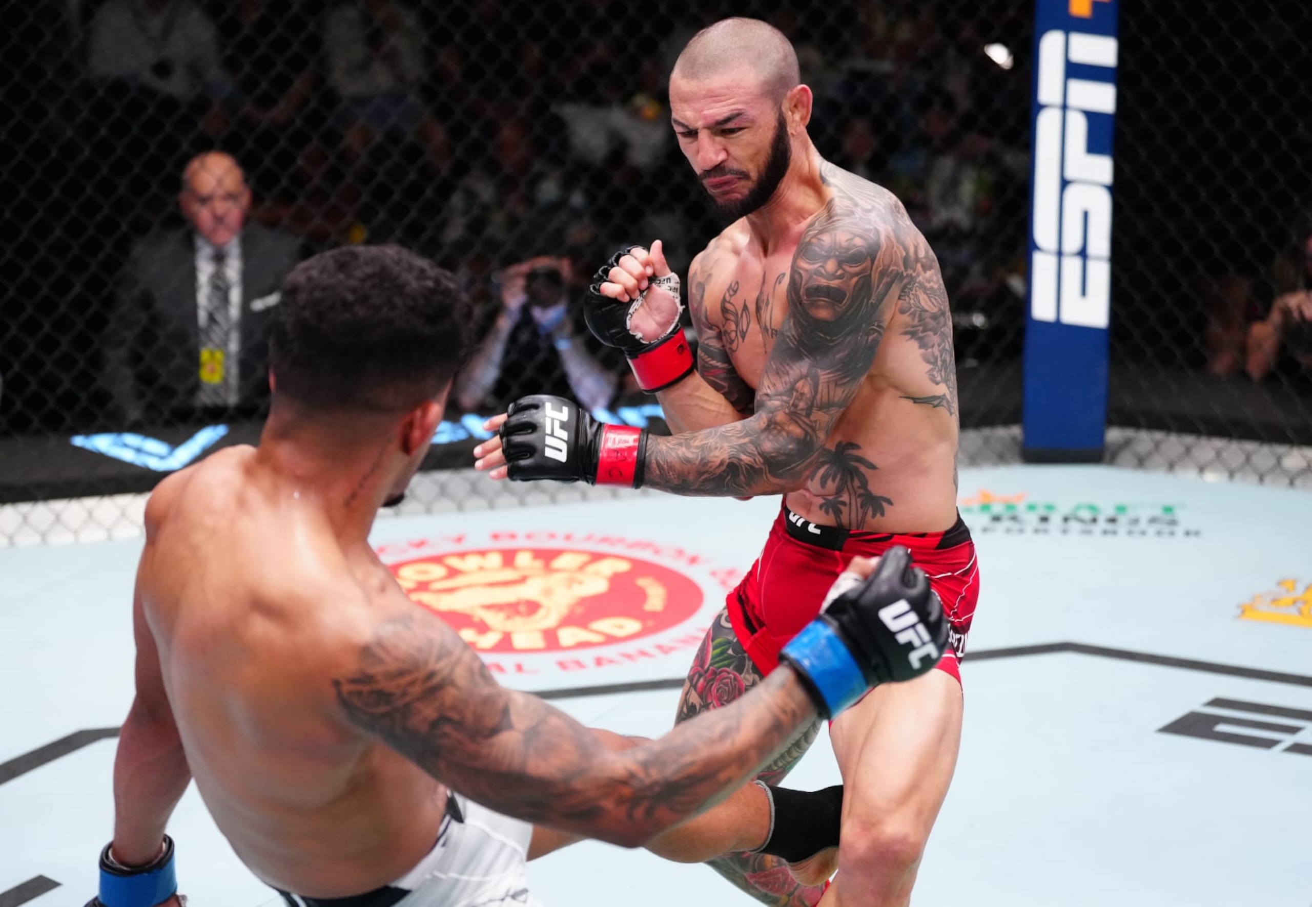 LAS VEGAS, NEVADA - OCTOBER 15: (L-R) Jonathan Martinez kicks the leg of Cub Swanson in a bantamweight fight during the UFC Fight Night event at UFC APEX on October 15, 2022 in Las Vegas, Nevada. (Photo by Jeff Bottari/Zuffa LLC)