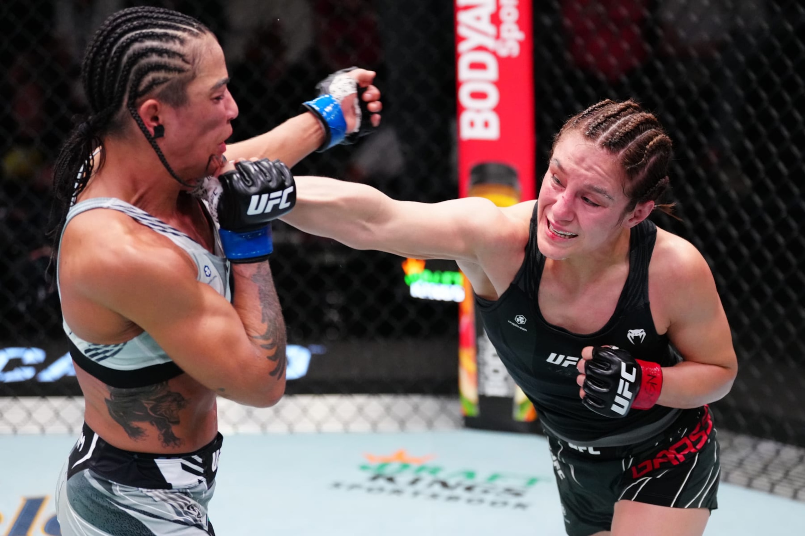 LAS VEGAS, NEVADA - OCTOBER 15: (R-L) Alexa Grasso of Mexico punches Viviane Araujo of Brazil in a flyweight fight during the UFC Fight Night event at UFC APEX on October 15, 2022 in Las Vegas, Nevada. (Photo by Jeff Bottari/Zuffa LLC)