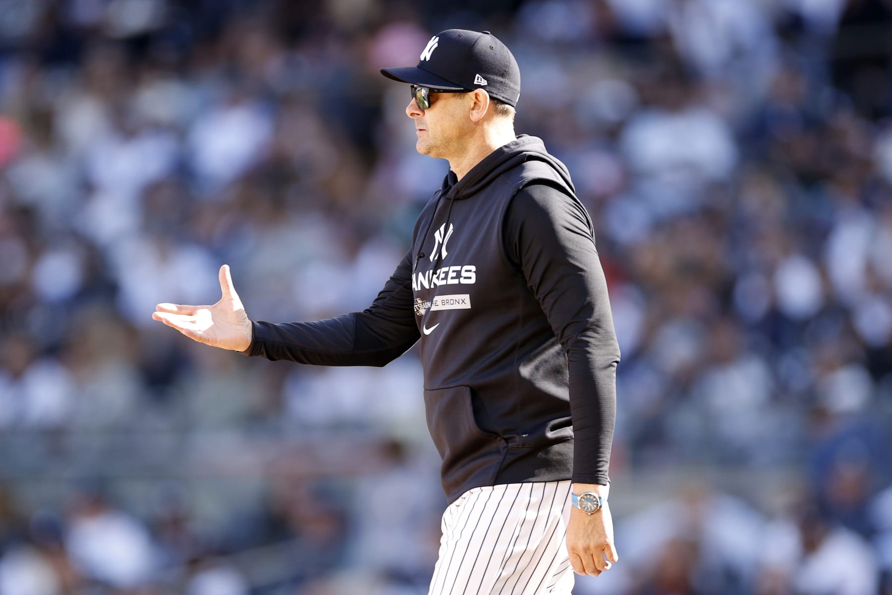 NEW YORK, NEW YORK - OCTOBER 14: Manager Aaron Boone of the New York Yankees makes a pitching change during the sixth inning against the Cleveland Guardians in game two of the American League Division Series at Yankee Stadium on October 14, 2022 in New York, New York. (Photo by Sarah Stier/Getty Images)