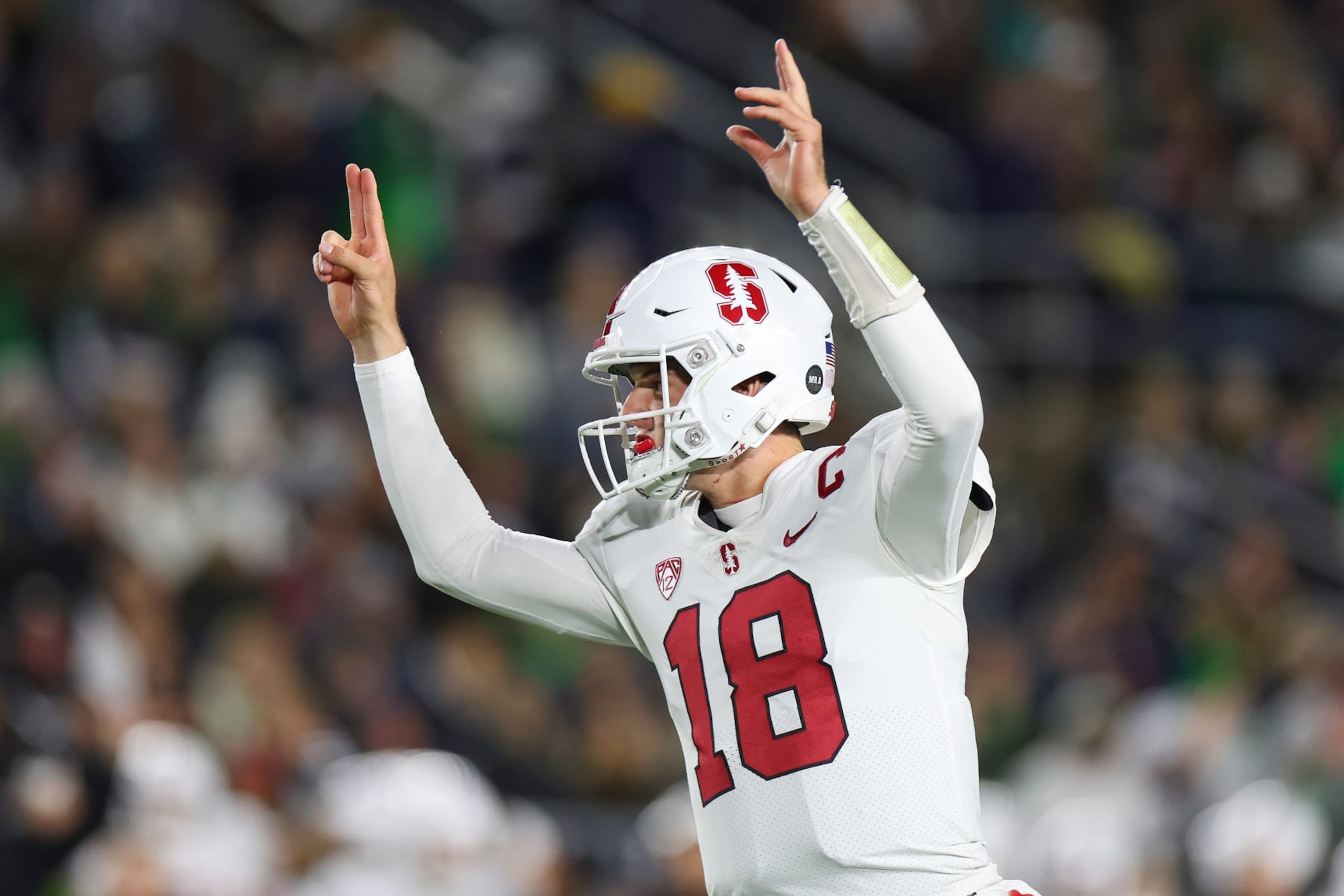 SOUTH BEND, INDIANA - OCTOBER 15: Tanner McKee #18 of the Stanford Cardinal celebrates a touchdown run by Casey Filkins #2 (not pictured) against the Notre Dame Fighting Irish during the first half at Notre Dame Stadium on October 15, 2022 in South Bend, Indiana. (Photo by Michael Reaves/Getty Images)