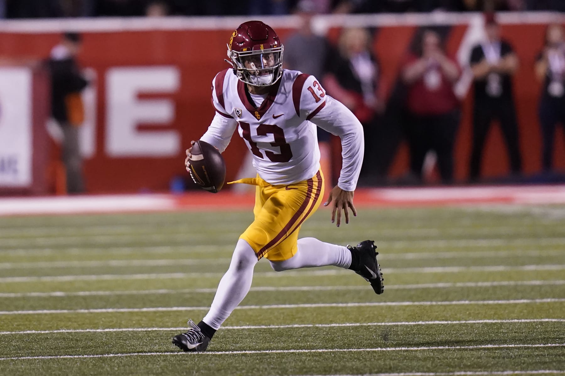Southern California quarterback Caleb Williams (13) carries the ball during the first half of an NCAA college football game against Utah Saturday, Oct. 15, 2022, in Salt Lake City. (AP Photo/Rick Bowmer)