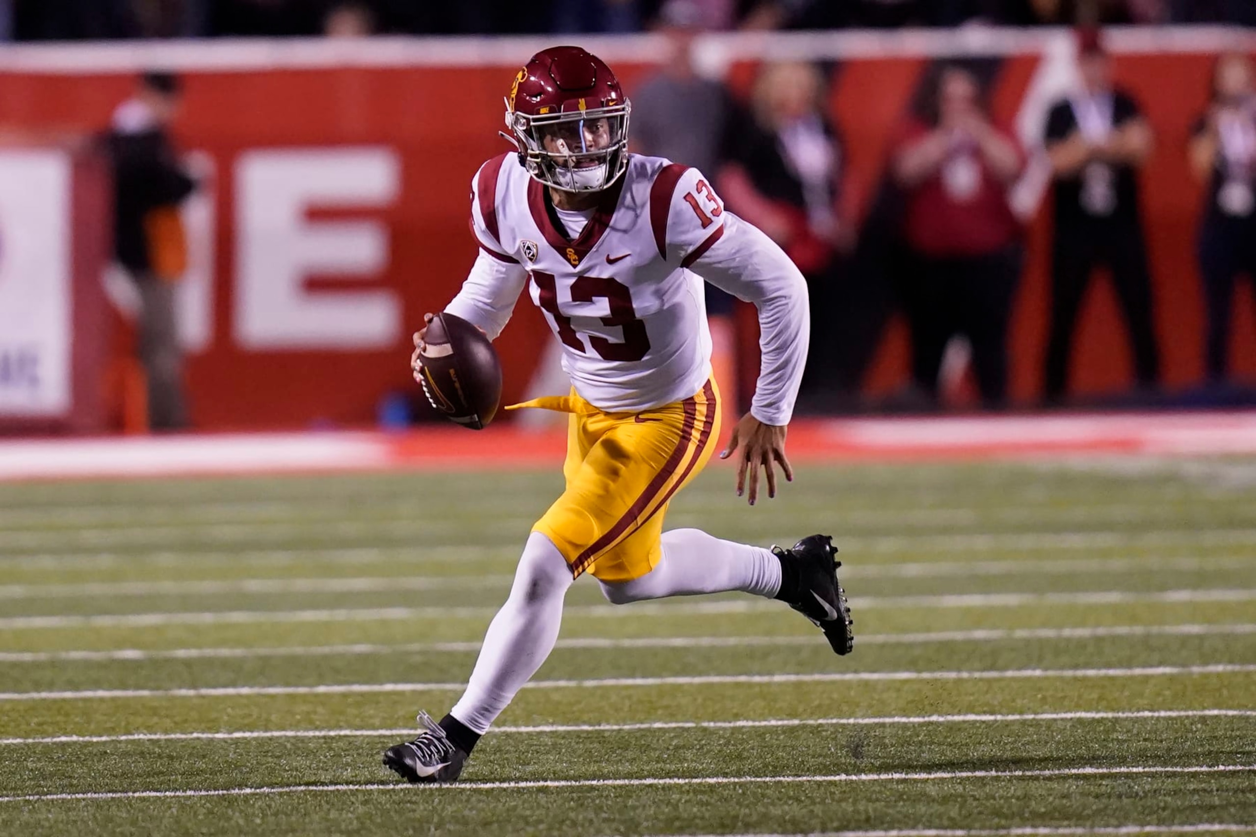 Southern California quarterback Caleb Williams (13) carries the ball during the first half of an NCAA college football game against Utah Saturday, Oct. 15, 2022, in Salt Lake City. (AP Photo/Rick Bowmer)