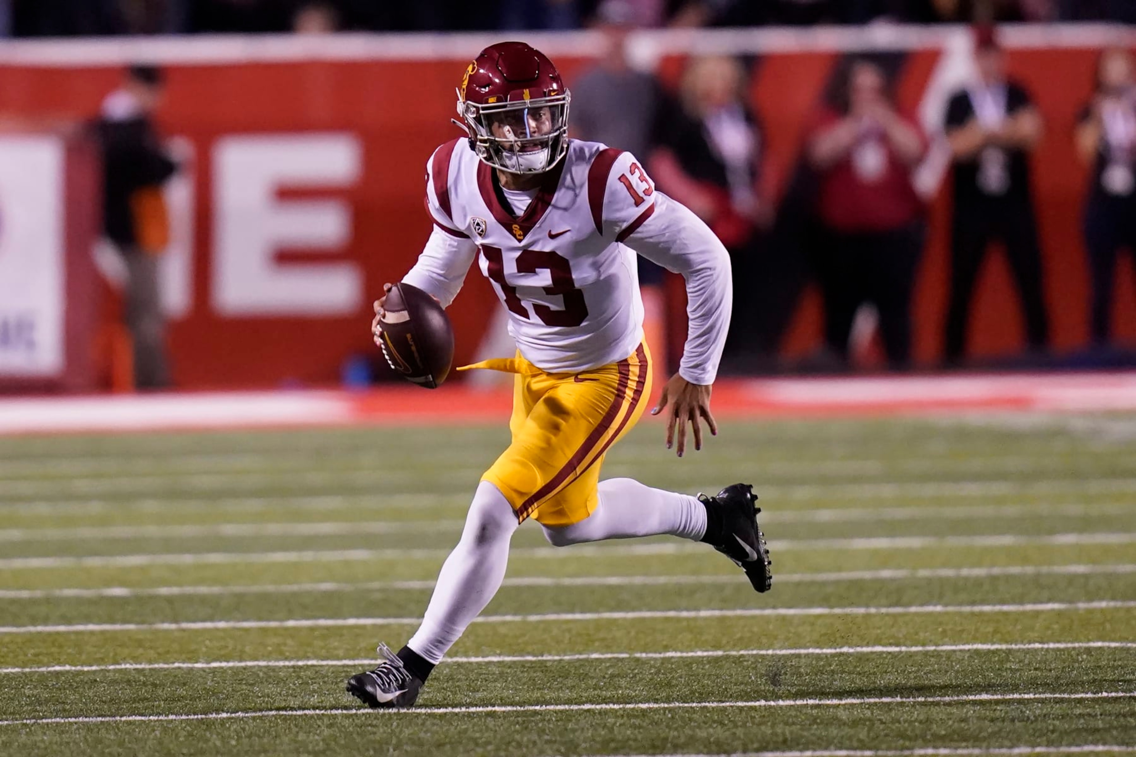 Southern California quarterback Caleb Williams (13) carries the ball during the first half of an NCAA college football game against Utah Saturday, Oct. 15, 2022, in Salt Lake City. (AP Photo/Rick Bowmer)