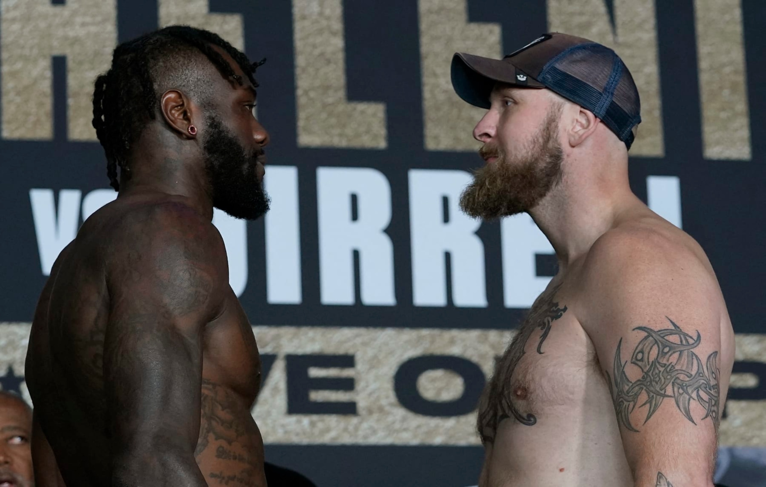 US boxer Deontay Wilder (L) and Swedish-Finnish boxer Robert Helenius face off after their weigh-in ahead of their WBC Heavyweight title fight in New York City on October 14, 2022. - Wilder and Helenius will fight on October 15, 2022 at Barclays Center. (Photo by TIMOTHY A. CLARY / AFP) (Photo by TIMOTHY A. CLARY/AFP via Getty Images)