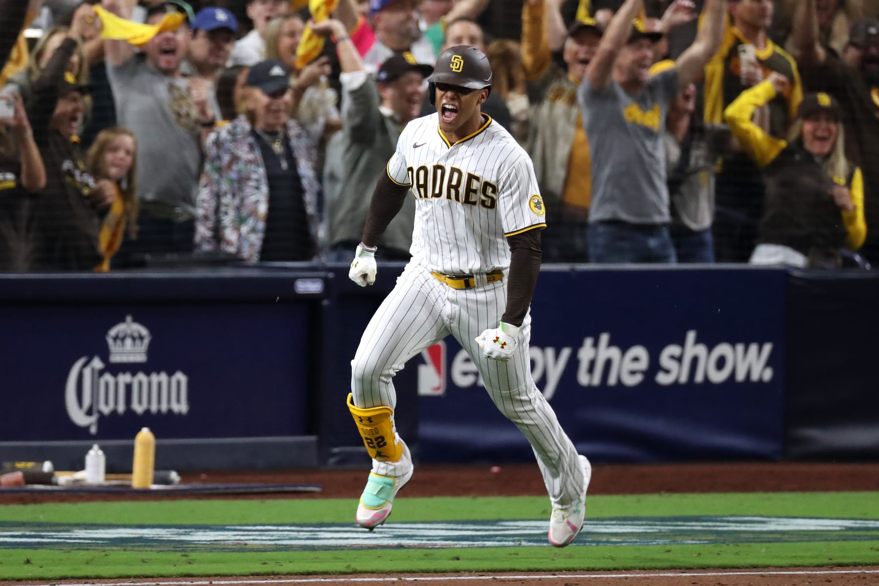 SAN DIEGO, CALIFORNIA - OCTOBER 15: Juan Soto #22 of the San Diego Padres celebrates after hitting a RBI single during the seventh inning against the Los Angeles Dodgers in game four of the National League Division Series at PETCO Park on October 15, 2022 in San Diego, California. (Photo by Denis Poroy/Getty Images)