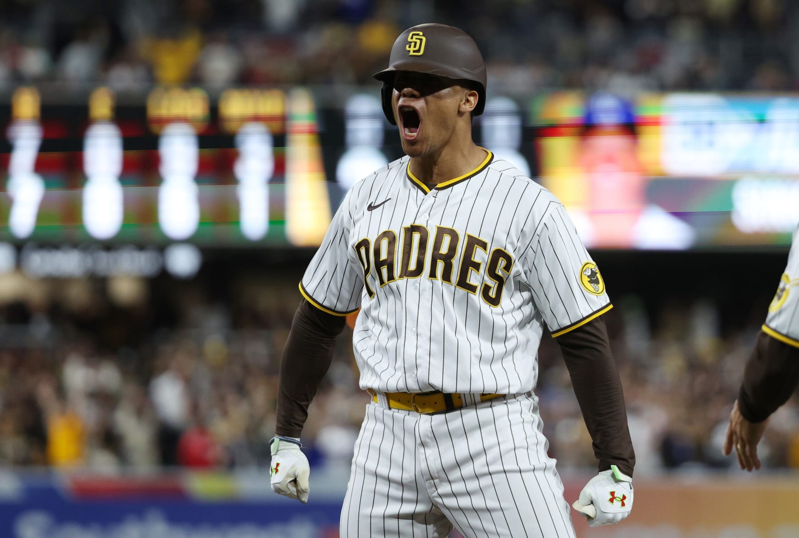 SAN DIEGO, CALIFORNIA - OCTOBER 15: Juan Soto #22 of the San Diego Padres celebrates after hitting a RBI single during the seventh inning against the Los Angeles Dodgers in game four of the National League Division Series at PETCO Park on October 15, 2022 in San Diego, California. (Photo by Harry How/Getty Images)