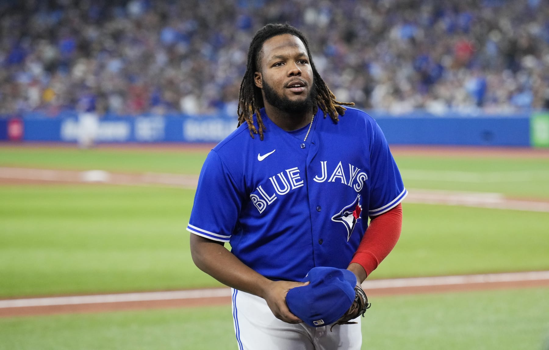 TORONTO, ON - OCTOBER 2: Vladimir Guerrero Jr. #27 of the Toronto Blue Jays smiles after coming off the field against the Boston Red Sox during the seventh inning in their MLB game at the Rogers Centre on October 2, 2022 in Toronto, Ontario, Canada. (Photo by Mark Blinch/Getty Images)