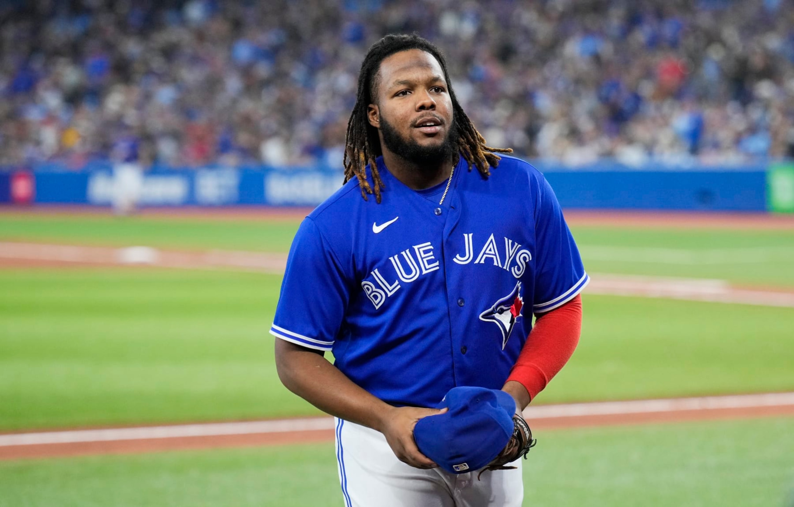 TORONTO, ON - OCTOBER 2: Vladimir Guerrero Jr. #27 of the Toronto Blue Jays smiles after coming off the field against the Boston Red Sox during the seventh inning in their MLB game at the Rogers Centre on October 2, 2022 in Toronto, Ontario, Canada. (Photo by Mark Blinch/Getty Images)