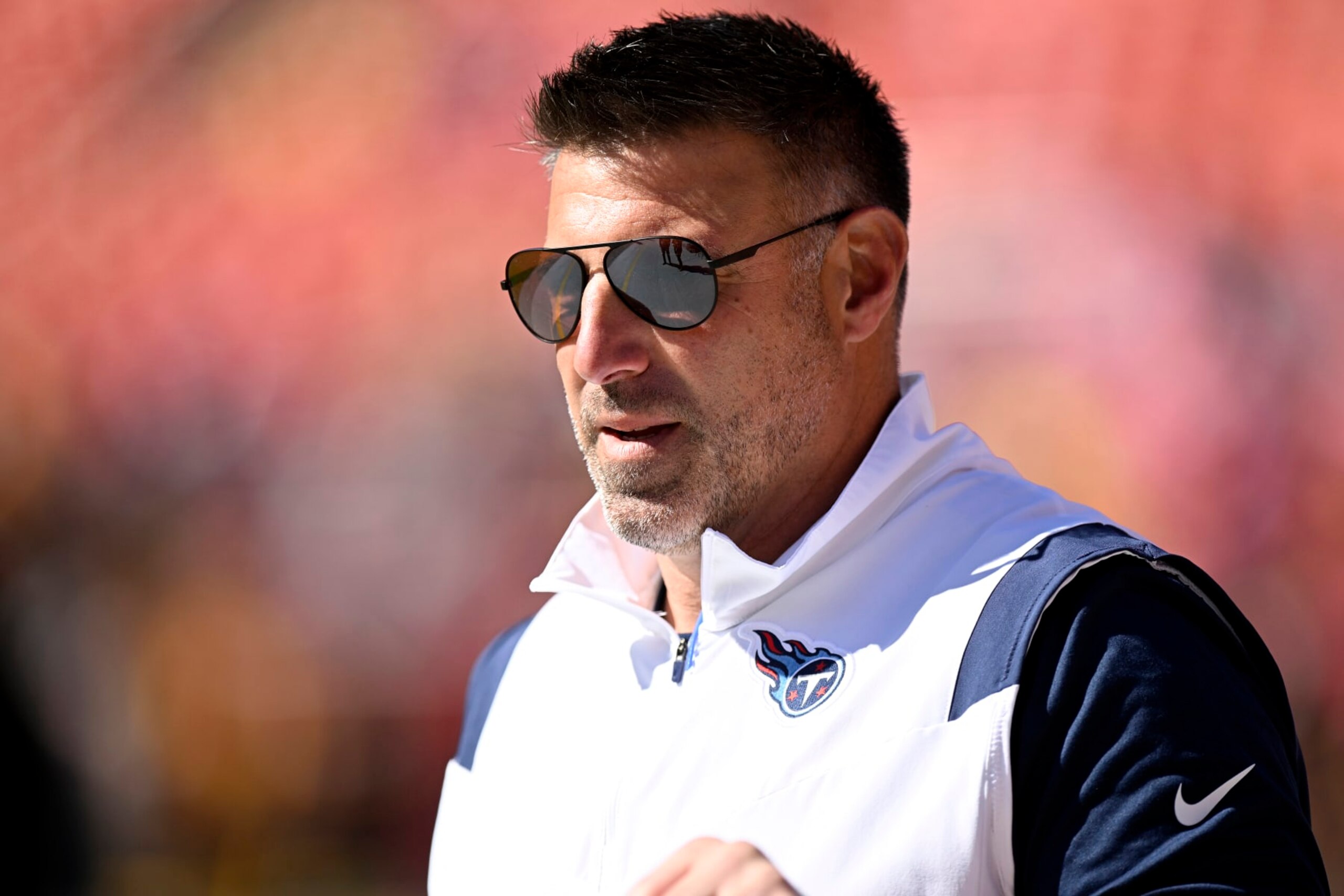 LANDOVER, MARYLAND - OCTOBER 09: Head coach Mike Vrabel of the Tennessee Titans watches his team warm up before their game against the Washington Commanders at FedExField on October 09, 2022 in Landover, Maryland. (Photo by Greg Fiume/Getty Images)
