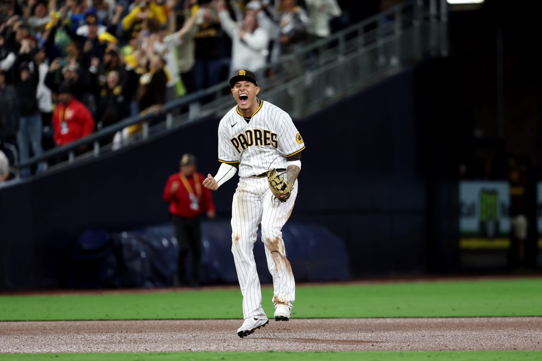SAN DIEGO, CA - OCTOBER 15:  Manny Machado #13 of the San Diego Padres celebrates after the Padres defeated the Los Angeles Dodgers at Petco Park on Saturday, October 15, 2022 in San Diego, California. (Photo by Rob Leiter/MLB Photos via Getty Images)