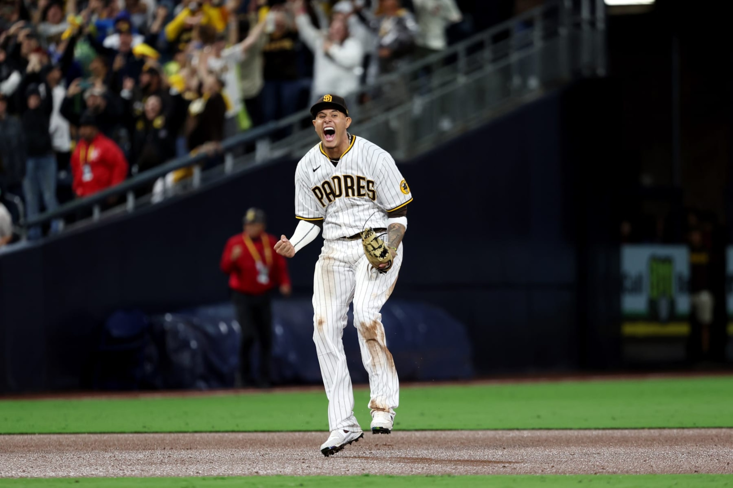 SAN DIEGO, CA - OCTOBER 15:  Manny Machado #13 of the San Diego Padres celebrates after the Padres defeated the Los Angeles Dodgers at Petco Park on Saturday, October 15, 2022 in San Diego, California. (Photo by Rob Leiter/MLB Photos via Getty Images)