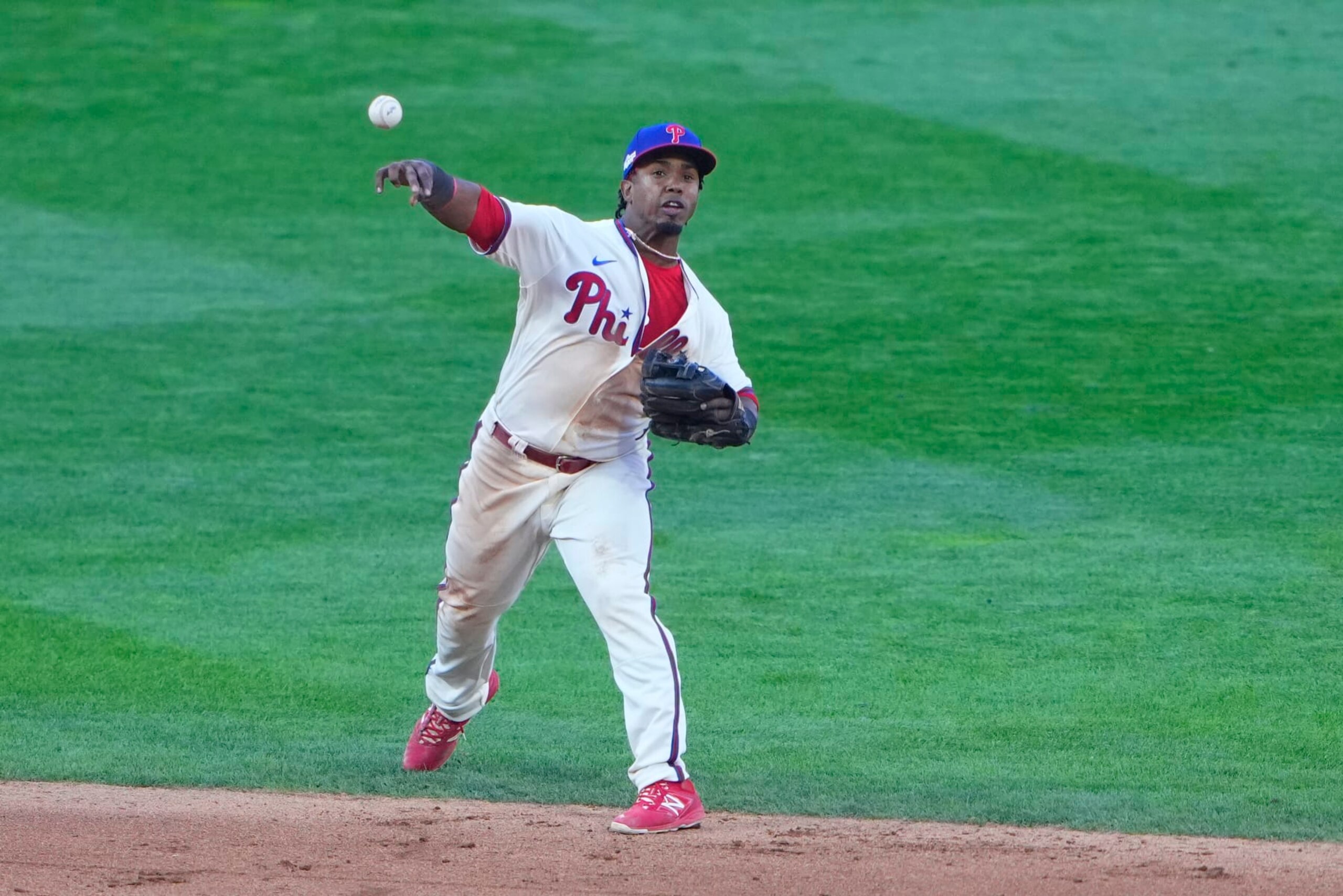 PHILADELPHIA, PA - OCTOBER 15: Philadelphia Phillies Second Baseman Jean Segura (2) throws out Atlanta Braves Right Fielder Ronald Acuna Jr. (13) (not pictured) after fielding a ground ball during the eighth inning of Game 4 of the NLDS between the Atlanta Braves and the Philadelphia Phillies on October 15, 2022, at Citizens Bank Park in Philadelphia, PA.(Photo by Gregory Fisher/Icon Sportswire via Getty Images)