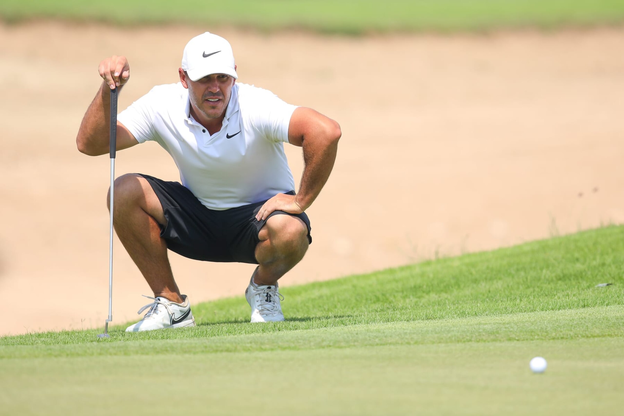JEDDAH, SAUDI ARABIA - OCTOBER 16: Team Captain Brooks Koepka of Smash GC lines up his third shot on the first hole during day three of the LIV Golf Invitational - Jeddah at Royal Greens Golf & Country Club on October 16, 2022 in King Abdullah Economic City, Saudi Arabia. (Photo by Charlie Crowhurst/LIV Golf via Getty Images)