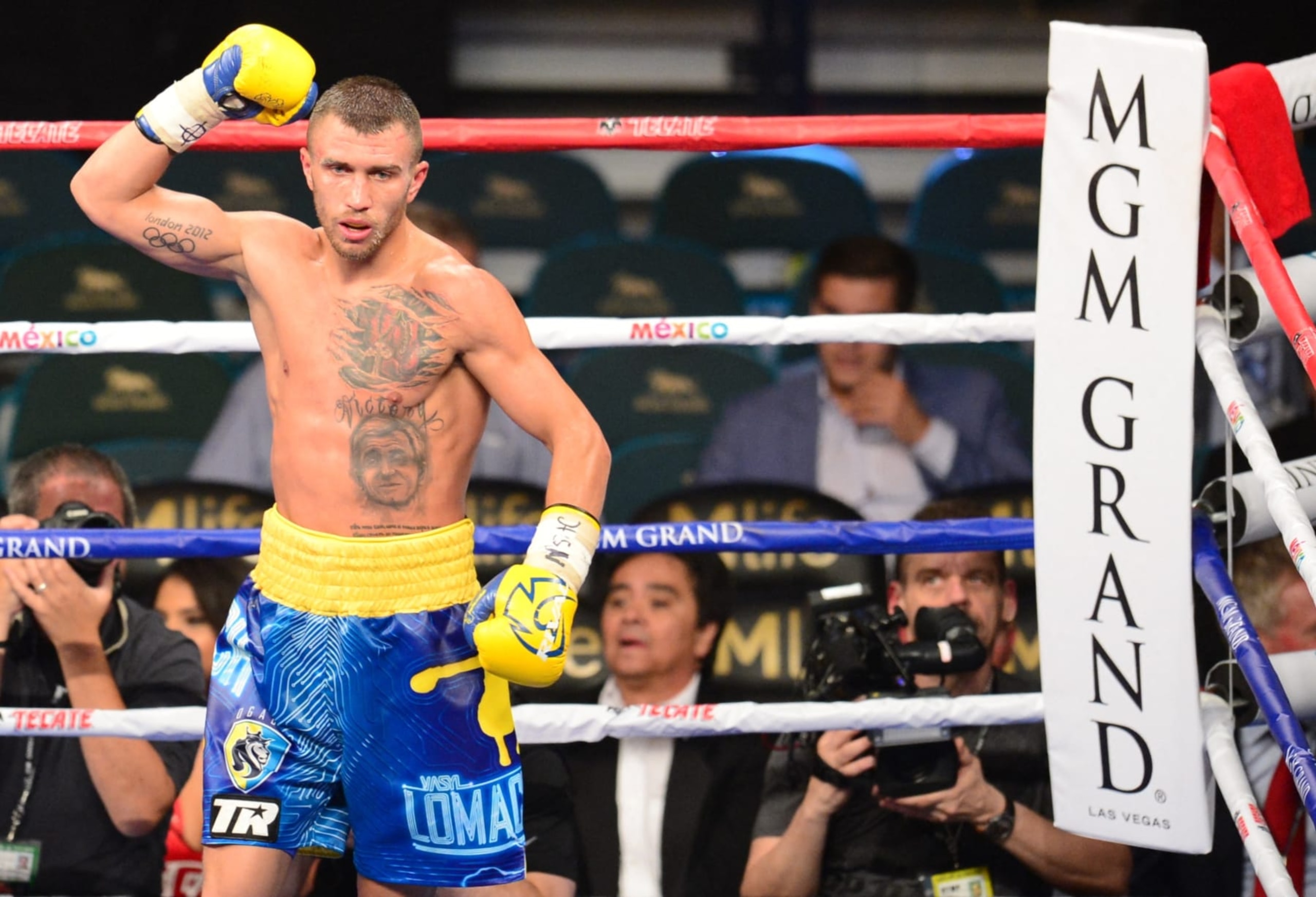 World featherweight boxing champion Vasyl Lomachenko of Ukraine celebrates his ninth round knockout victory over Gamalier Rodriguez of Puerto Rico  on May 2, 2015 at the MGM Grand Garden Arena in Las Vegas, Nevada. AFP PHOTO / FREDERIC J. BROWN (Photo by Frederic J. BROWN / AFP) (Photo by FREDERIC J. BROWN/AFP via Getty Images)