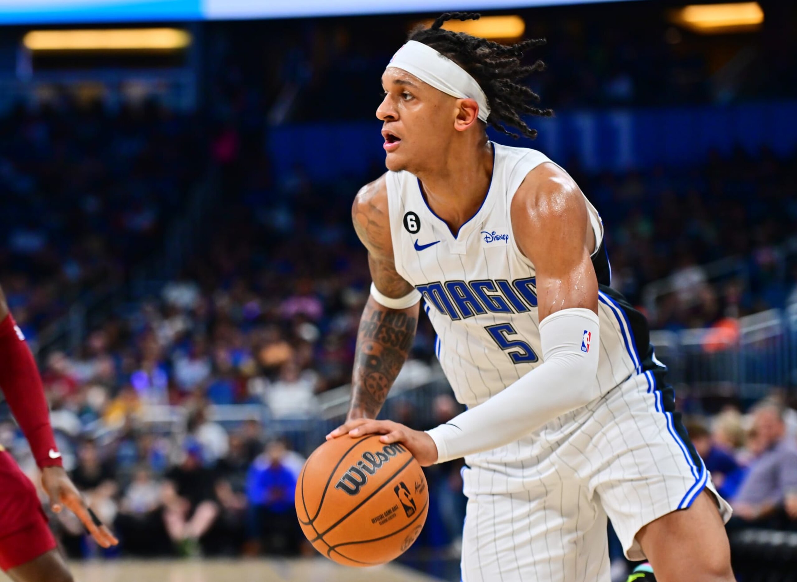 ORLANDO, FLORIDA - OCTOBER 14: Paolo Banchero #5 of the Orlando Magic dribbles the ball to the net against the Cleveland Cavaliers at Amway Center on October 14, 2022 in Orlando, Florida. NOTE TO USER: User expressly acknowledges and agrees that, by downloading and or using this photograph, User is consenting to the terms and conditions of the Getty Images License Agreement. (Photo by Julio Aguilar/Getty Images)