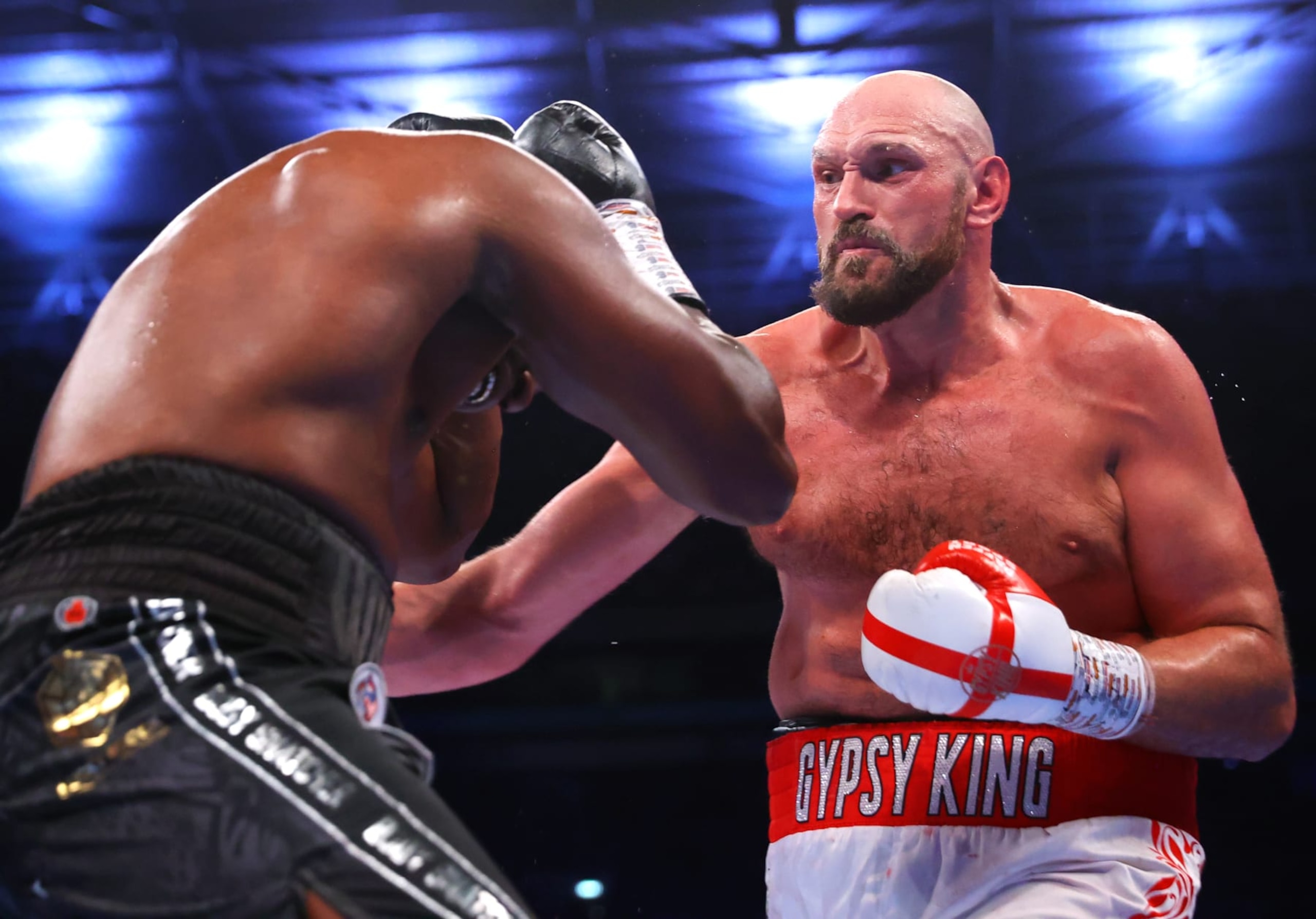 LONDON, ENGLAND - APRIL 23: Dillian Whyte (L) and Tyson Fury (R) exchange punches during their WBC heavyweight championship fight at Wembley Stadium on April 23, 2022 in London, England. (Photo by Mikey Williams/Top Rank Inc via Getty Images)