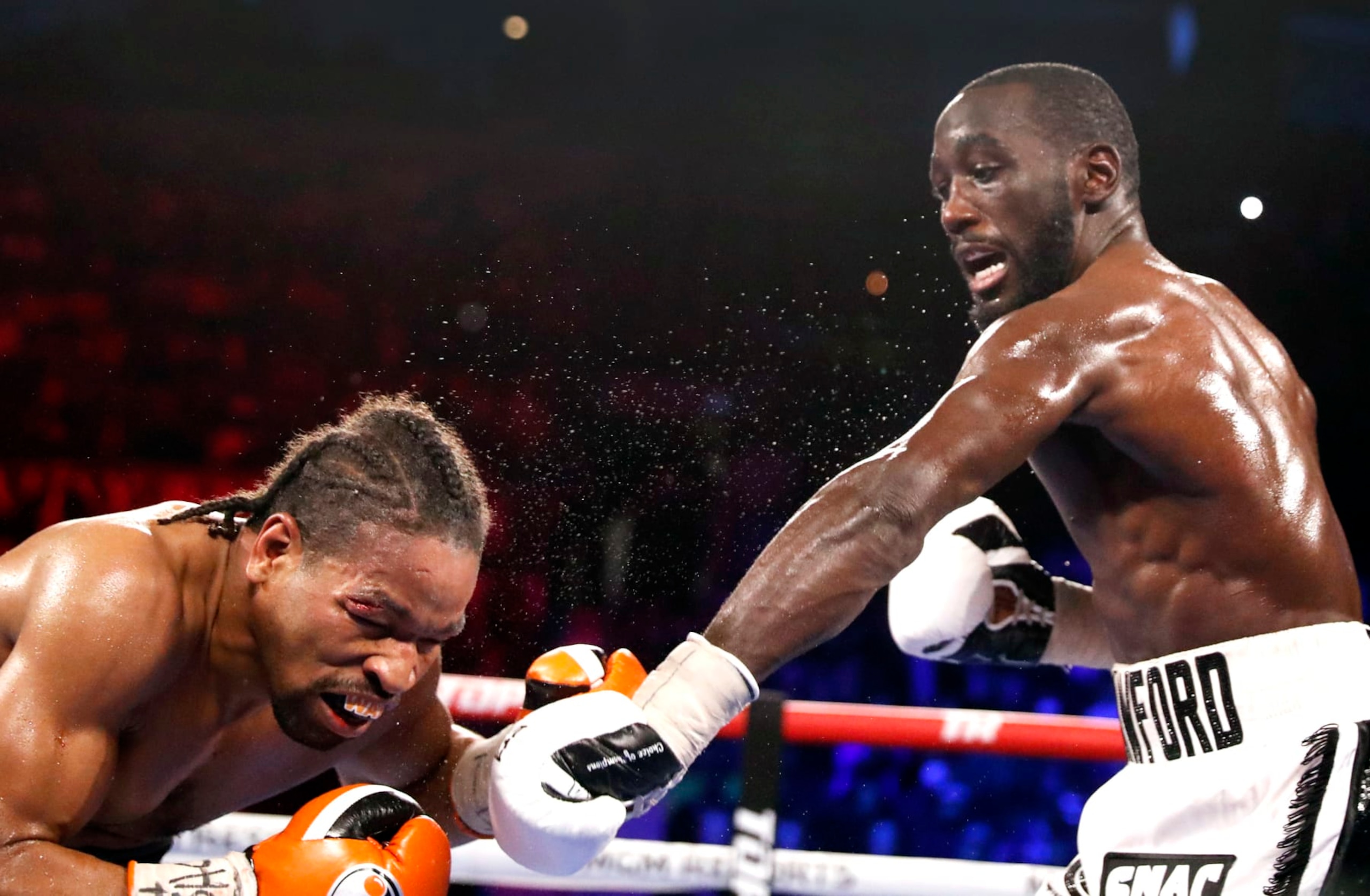 LAS VEGAS, NEVADA - NOVEMBER 20: WBO champion Terence Crawford (R) punches Shawn Porter during their welterweight title fight at Michelob ULTRA Arena on November 20, 2021 in Las Vegas, Nevada. Crawford retained his title with a 10th-round TKO. (Photo by Steve Marcus/Getty Images)
