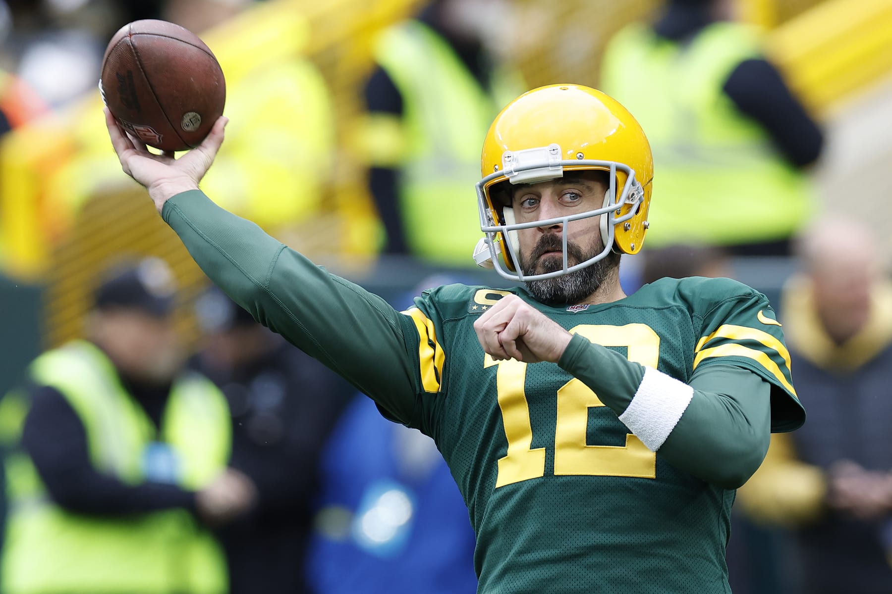 GREEN BAY, WISCONSIN - OCTOBER 16: Aaron Rodgers #12 of the Green Bay Packers throws during pregame warmups at Lambeau Field on October 16, 2022 in Green Bay, Wisconsin. (Photo by John Fisher/Getty Images)
