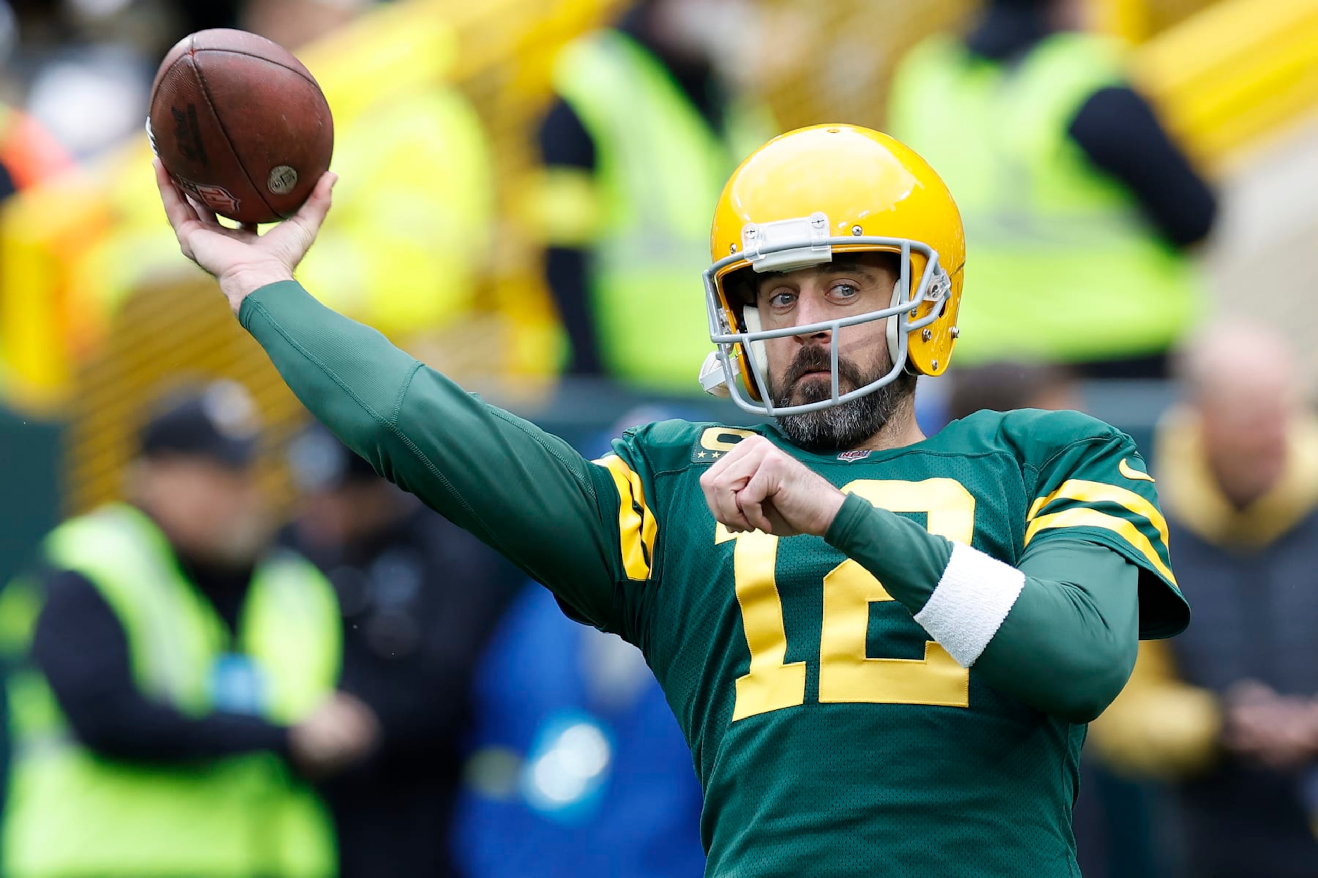 GREEN BAY, WISCONSIN - OCTOBER 16: Aaron Rodgers #12 of the Green Bay Packers throws during pregame warmups at Lambeau Field on October 16, 2022 in Green Bay, Wisconsin. (Photo by John Fisher/Getty Images)