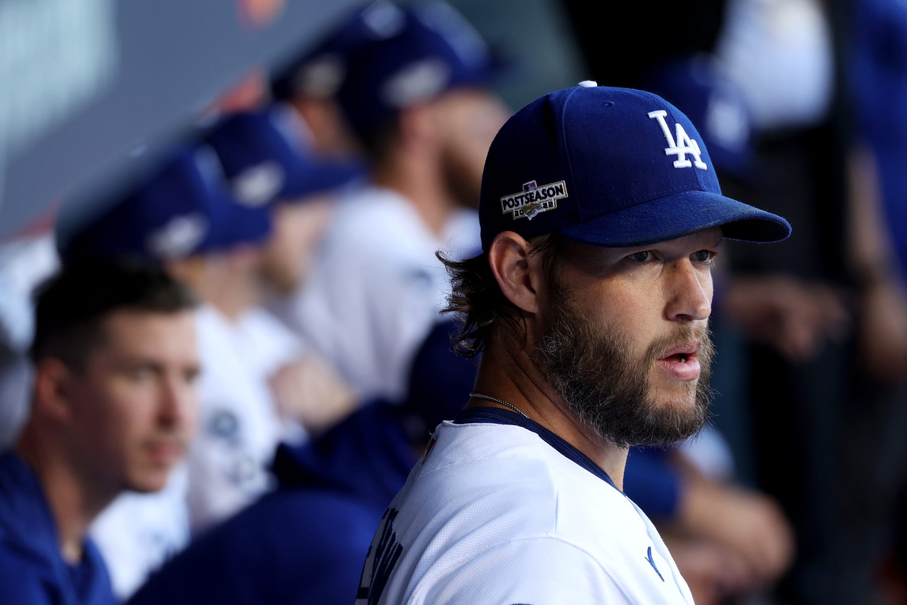 LOS ANGELES, CALIFORNIA - OCTOBER 12: Clayton Kershaw #22 of the Los Angeles Dodgers looks on from the dugout before game two of the National League Division Series against the San Diego Padres at Dodger Stadium on October 12, 2022 in Los Angeles, California. (Photo by Harry How/Getty Images)