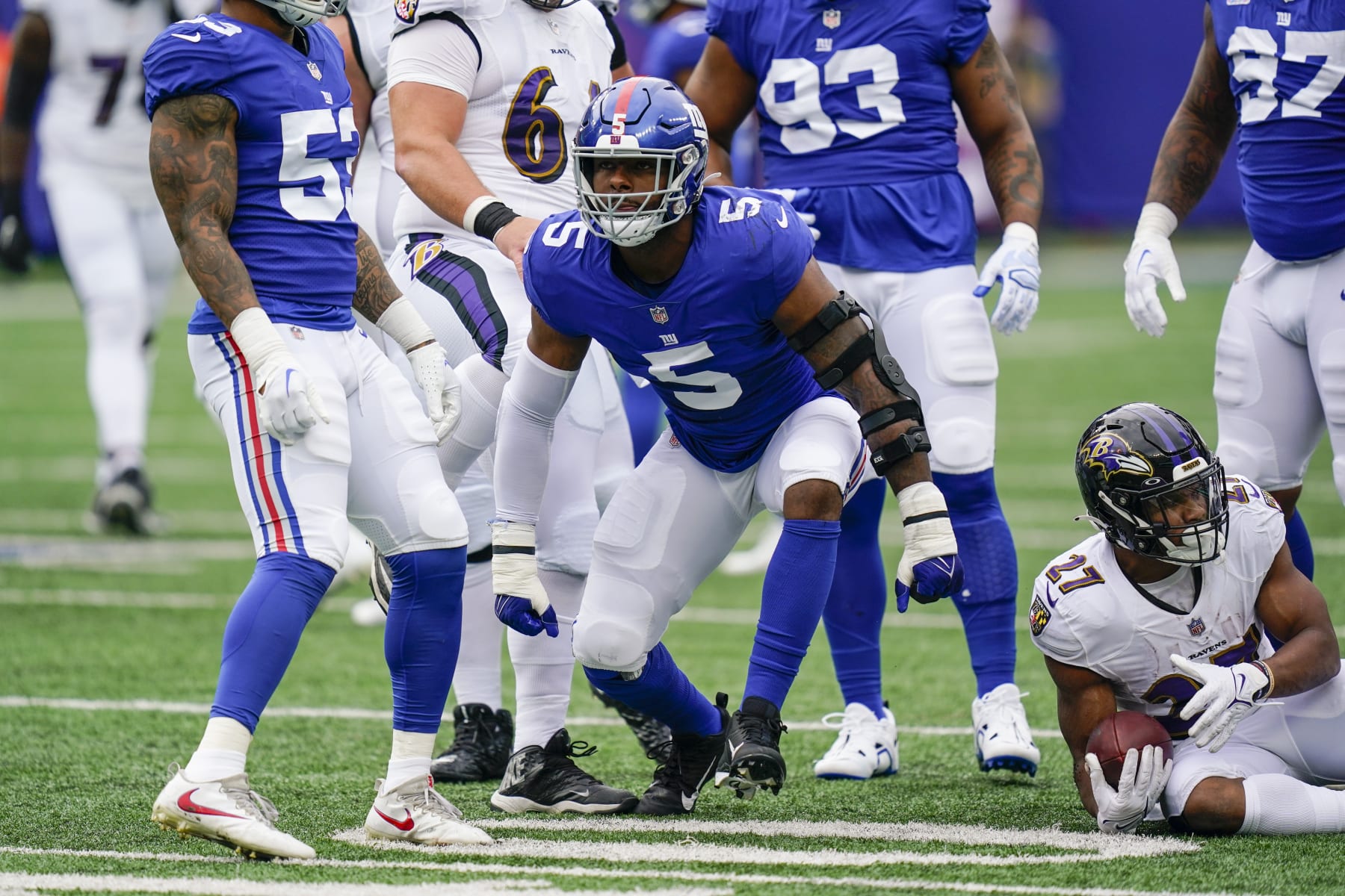New York Giants defensive end Kayvon Thibodeaux (5) celebrates after tackling Baltimore Ravens' J.K. Dobbins (27) during the first half of an NFL football game Sunday, Oct. 16, 2022, in East Rutherford, N.J. (AP Photo/Seth Wenig)