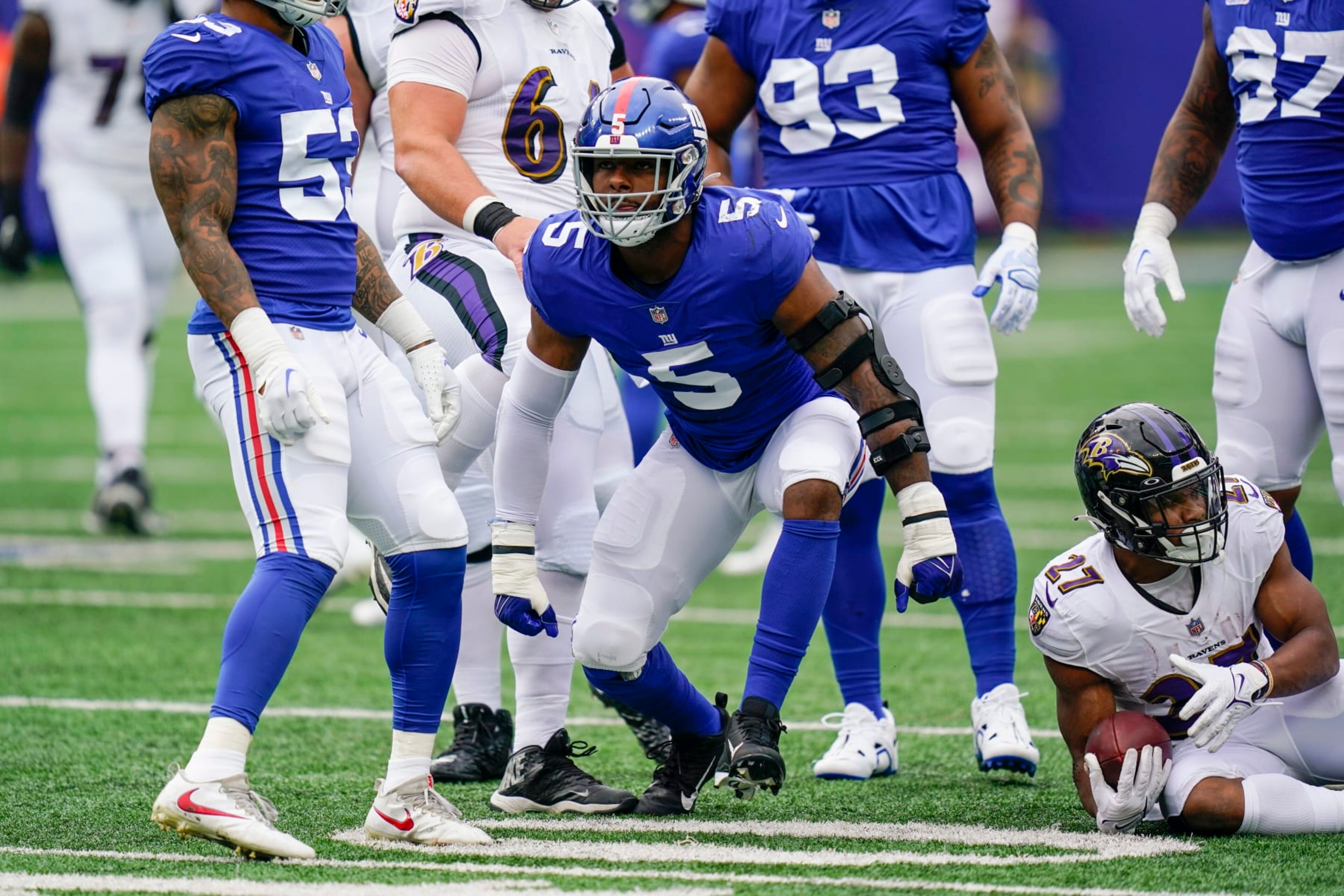 New York Giants defensive end Kayvon Thibodeaux (5) celebrates after tackling Baltimore Ravens' J.K. Dobbins (27) during the first half of an NFL football game Sunday, Oct. 16, 2022, in East Rutherford, N.J. (AP Photo/Seth Wenig) New York Giants defensive end Kayvon Thibodeaux (5) celebrates after tackling Baltimore Ravens' J.K. Dobbins (27) during the first half of an NFL football game Sunday, Oct. 16, 2022, in East Rutherford, N.J. (AP Photo/Seth Wenig)