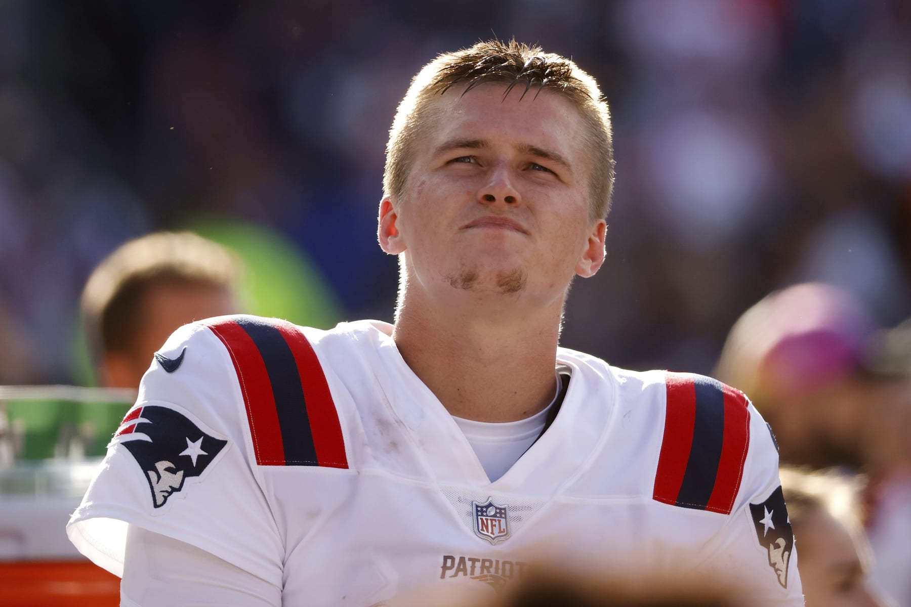 New England Patriots quarterback Bailey Zappe (4) stands on the sideline during an NFL football game against the Cleveland Browns, Sunday, Oct. 16, 2022, in Cleveland. (AP Photo/Kirk Irwin)