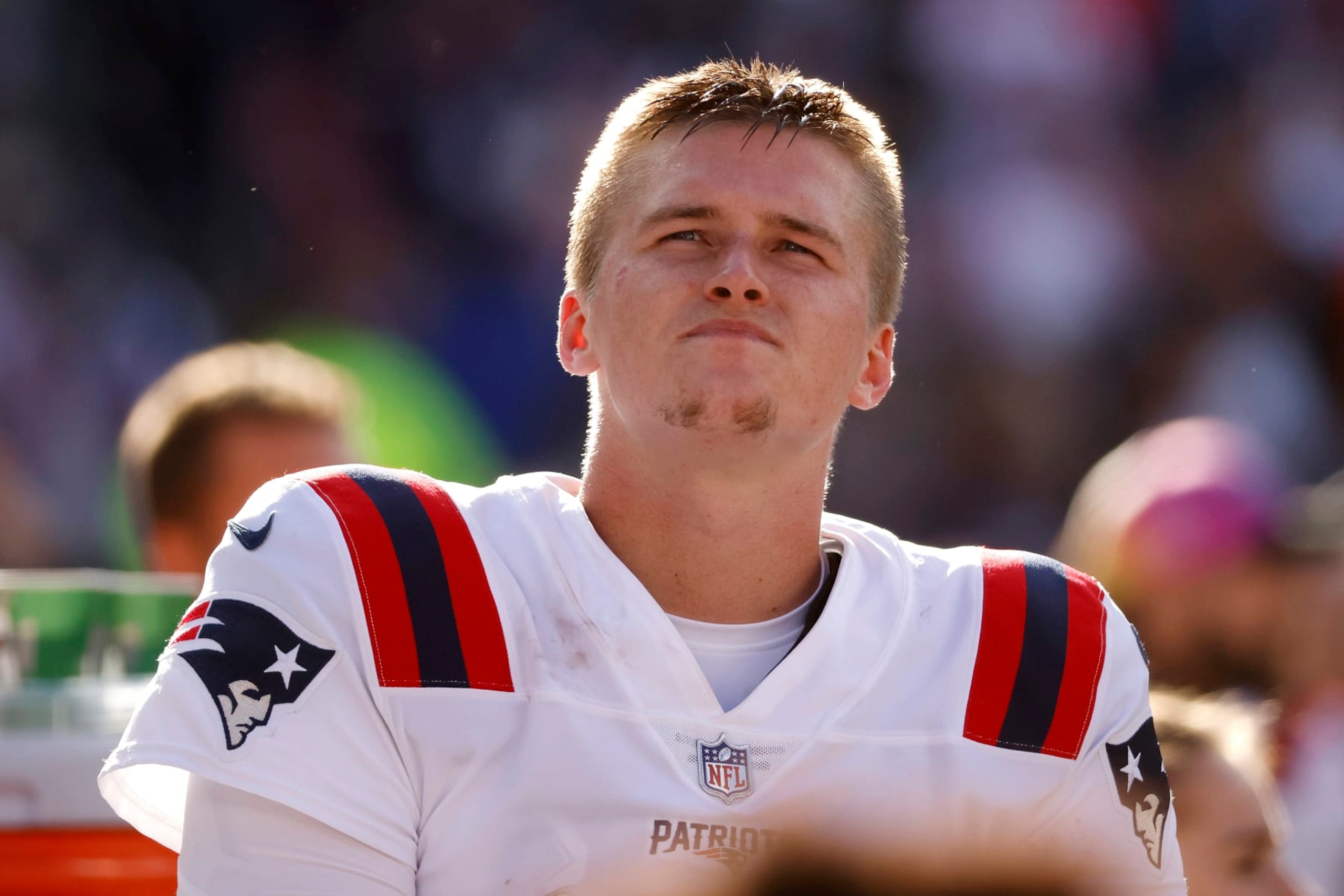 New England Patriots quarterback Bailey Zappe (4) stands on the sideline during an NFL football game against the Cleveland Browns, Sunday, Oct. 16, 2022, in Cleveland. (AP Photo/Kirk Irwin)