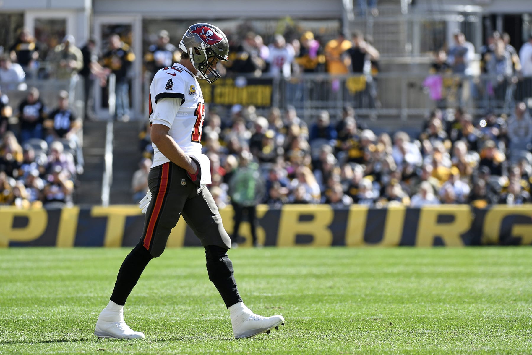 Tampa Bay Buccaneers quarterback Tom Brady walks onto the field during the first half of an NFL football game against the Pittsburgh Steelers in Pittsburgh, Sunday, Oct. 16, 2022. (AP Photo/Don Wright)