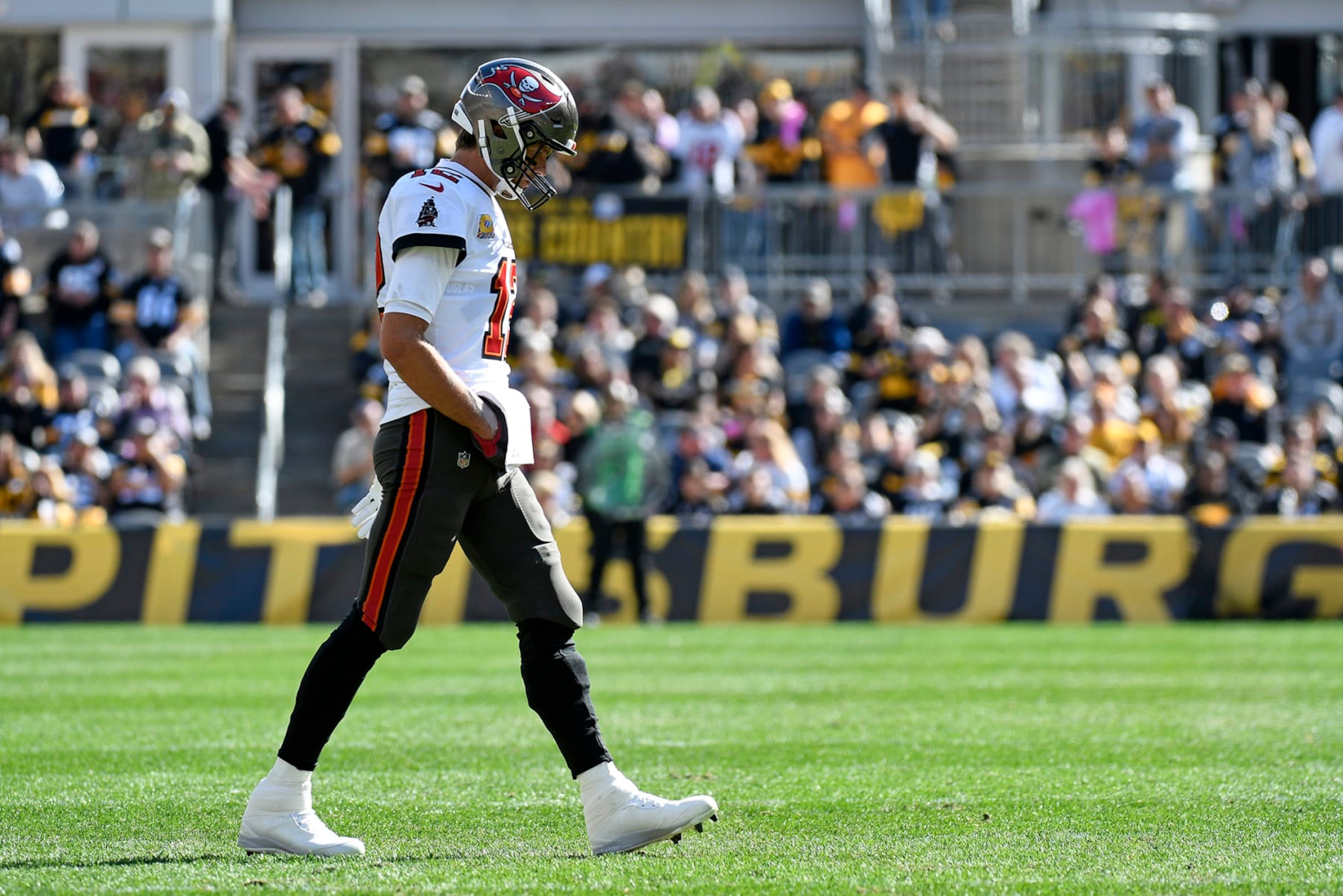 Tampa Bay Buccaneers quarterback Tom Brady walks onto the field during the first half of an NFL football game against the Pittsburgh Steelers in Pittsburgh, Sunday, Oct. 16, 2022. (AP Photo/Don Wright) Tampa Bay Buccaneers quarterback Tom Brady walks onto the field during the first half of an NFL football game against the Pittsburgh Steelers in Pittsburgh, Sunday, Oct. 16, 2022. (AP Photo/Don Wright)