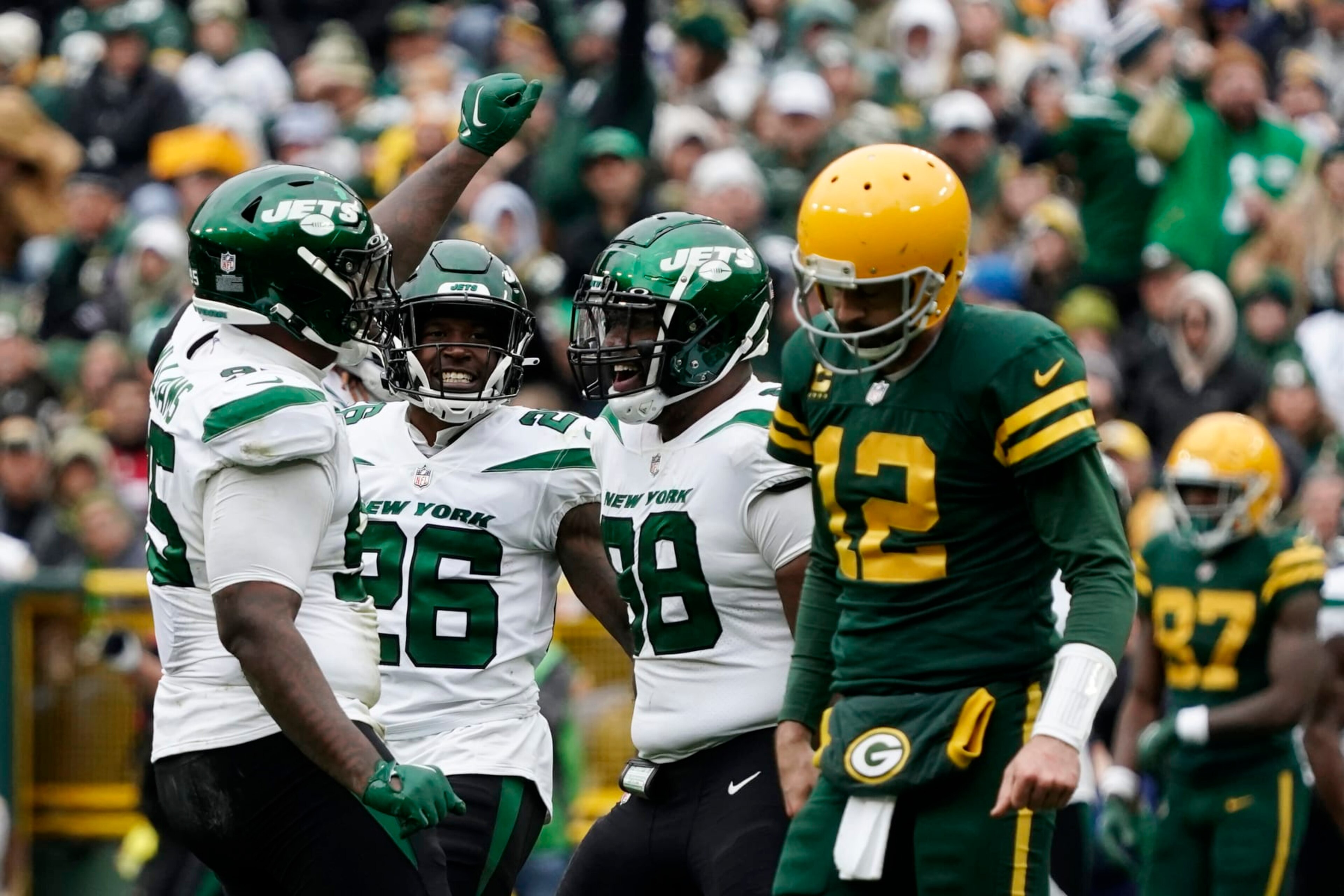 New York Jets defensive end John Franklin-Myers, left, celebrates with teammates after sacking Green Bay Packers quarterback Aaron Rodgers (12) during the second half of an NFL football game Sunday, Oct. 16, 2022, in Green Bay, Wis. (AP Photo/Morry Gash) New York Jets defensive end John Franklin-Myers, left, celebrates with teammates after sacking Green Bay Packers quarterback Aaron Rodgers (12) during the second half of an NFL football game Sunday, Oct. 16, 2022, in Green Bay, Wis. (AP Photo/Morry Gash)