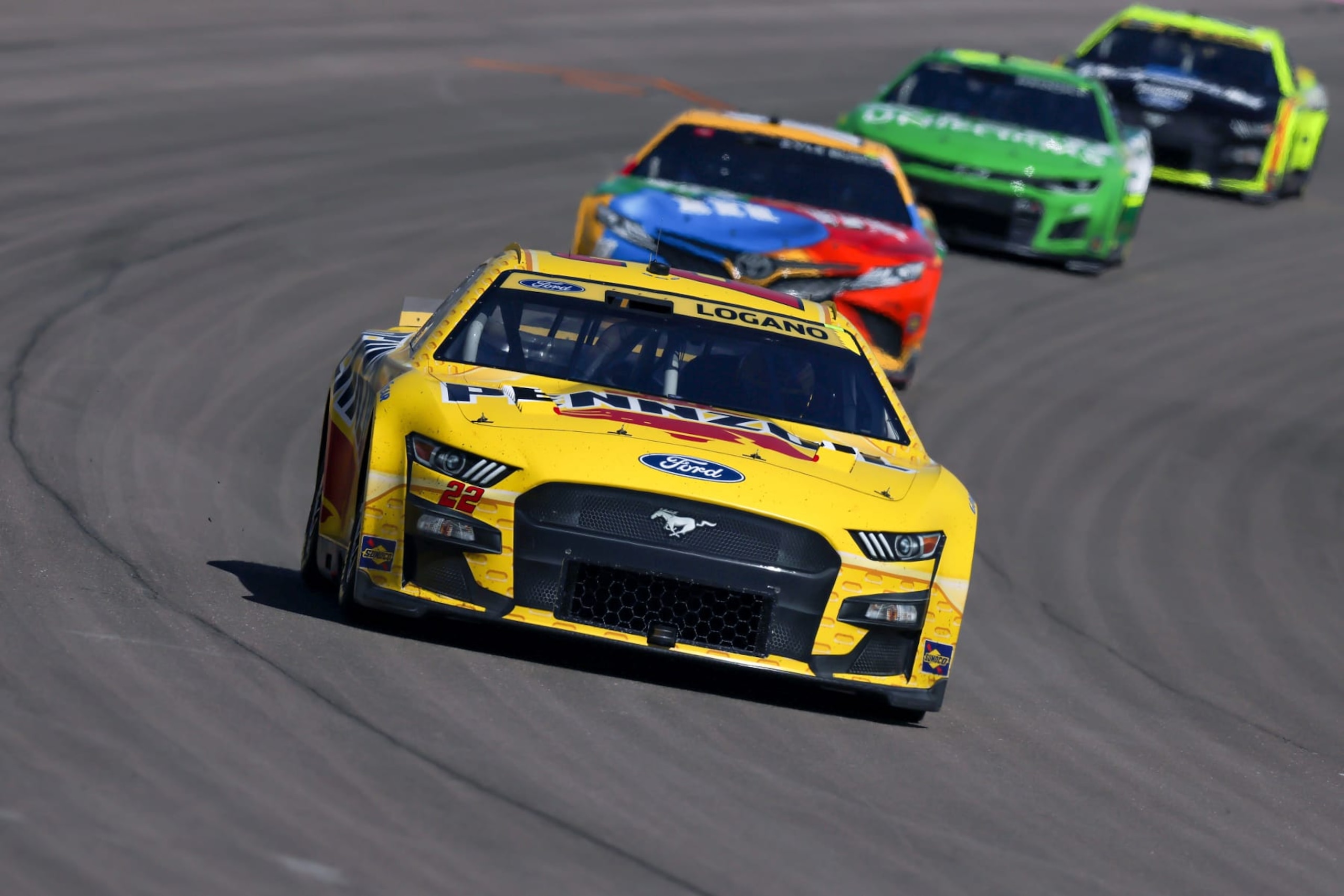 LAS VEGAS, NEVADA - OCTOBER 16: Joey Logano, driver of the #22 Shell Pennzoil Ford, leads the field during the NASCAR Cup Series South Point 400 at Las Vegas Motor Speedway on October 16, 2022 in Las Vegas, Nevada. (Photo by Jonathan Bachman/Getty Images)